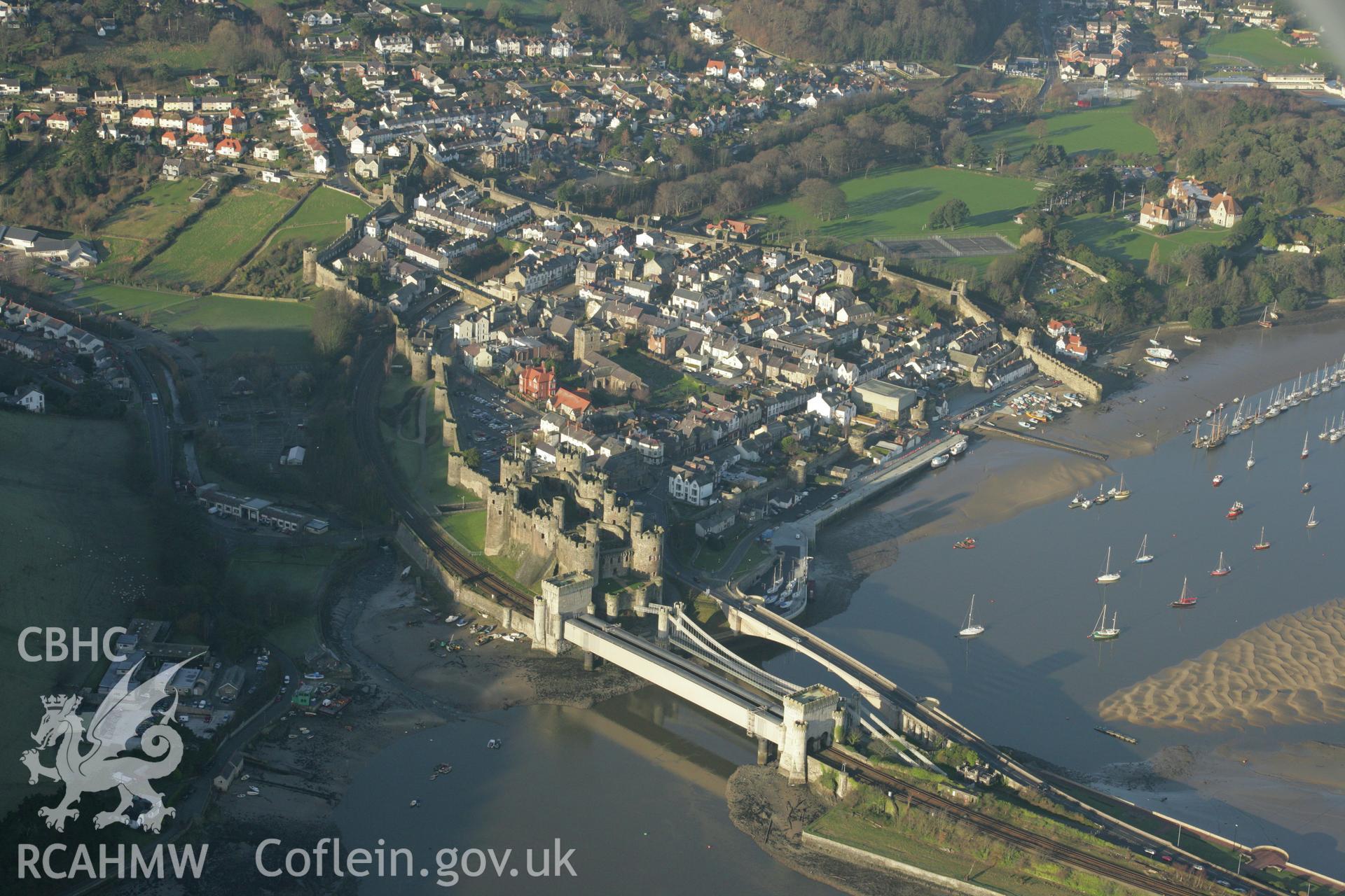 RCAHMW colour oblique aerial photograph of Conwy Castle and the town walls. Taken on 25 January 2007 by Toby Driver