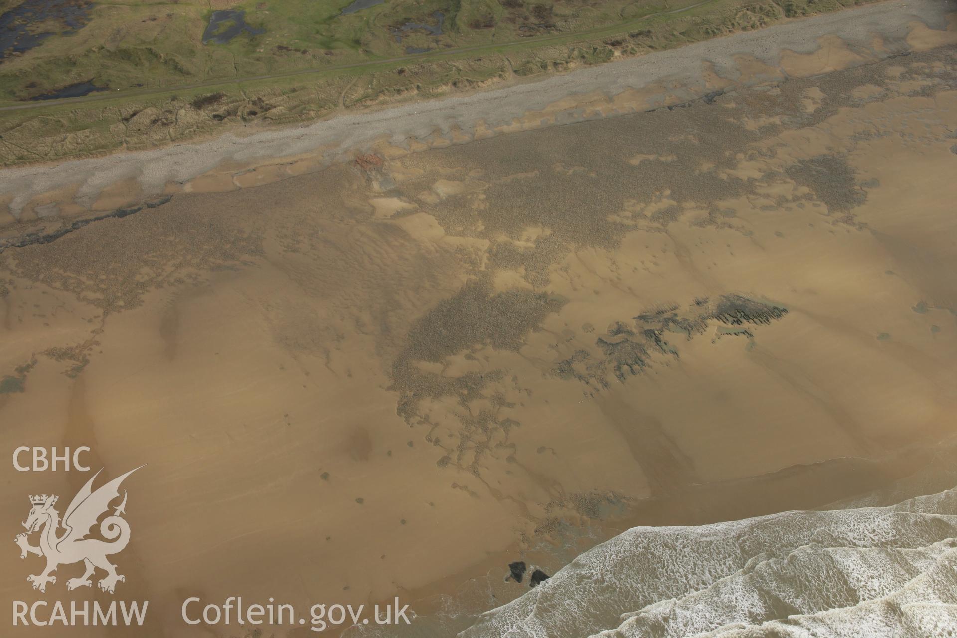 RCAHMW colour oblique aerial photograph of Gwely'r Misgl Wreck on Kenfig Sands. Taken on 16 March 2007 by Toby Driver
