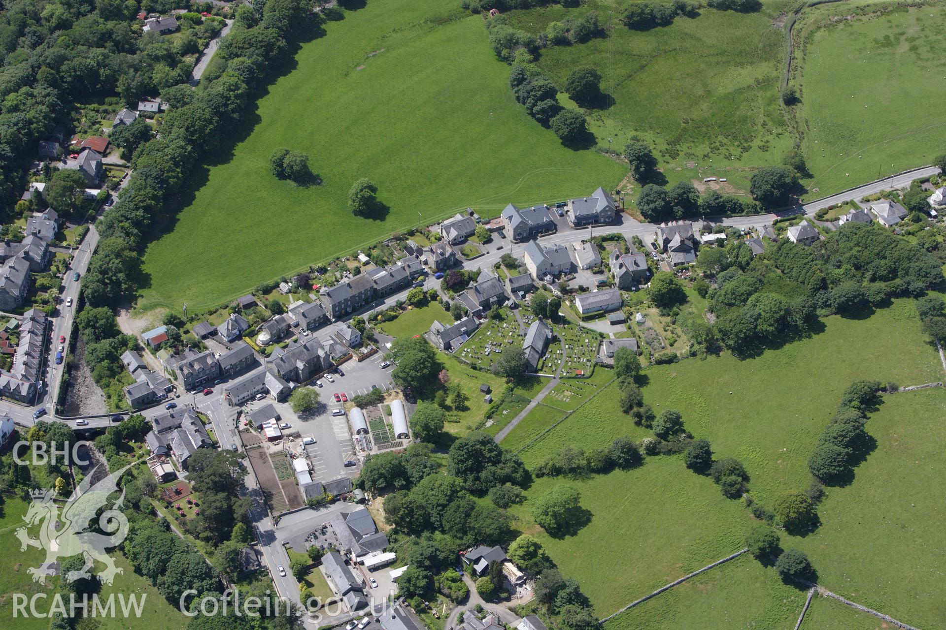RCAHMW colour oblique aerial photograph of Llanbedr village. Taken on 16 June 2009 by Toby Driver