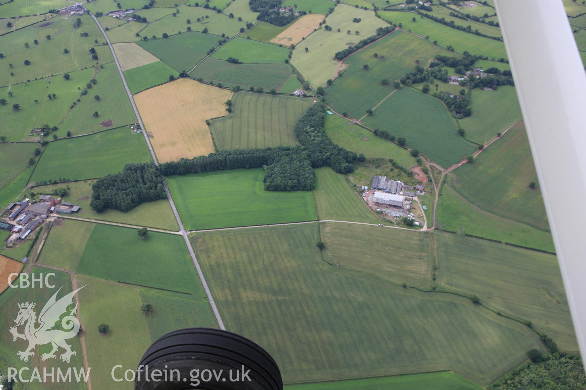 RCAHMW colour oblique aerial photograph of Gerwyn-Fechan Cropmarks. Taken on 08 July 2009 by Toby Driver