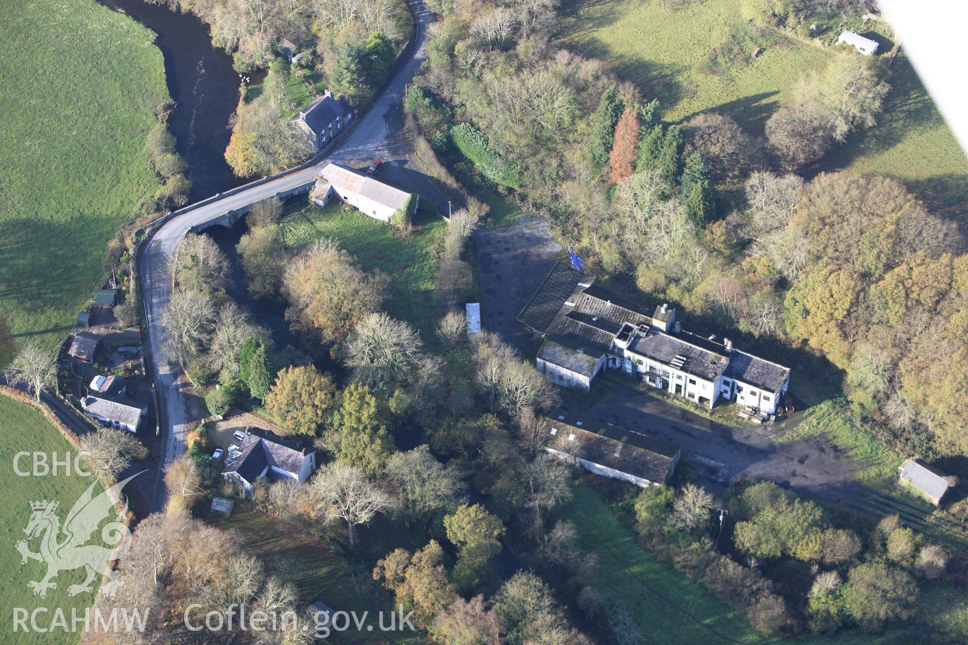 RCAHMW colour oblique aerial photograph of Milk Factory at Pont Llanio. Taken on 09 November 2009 by Toby Driver