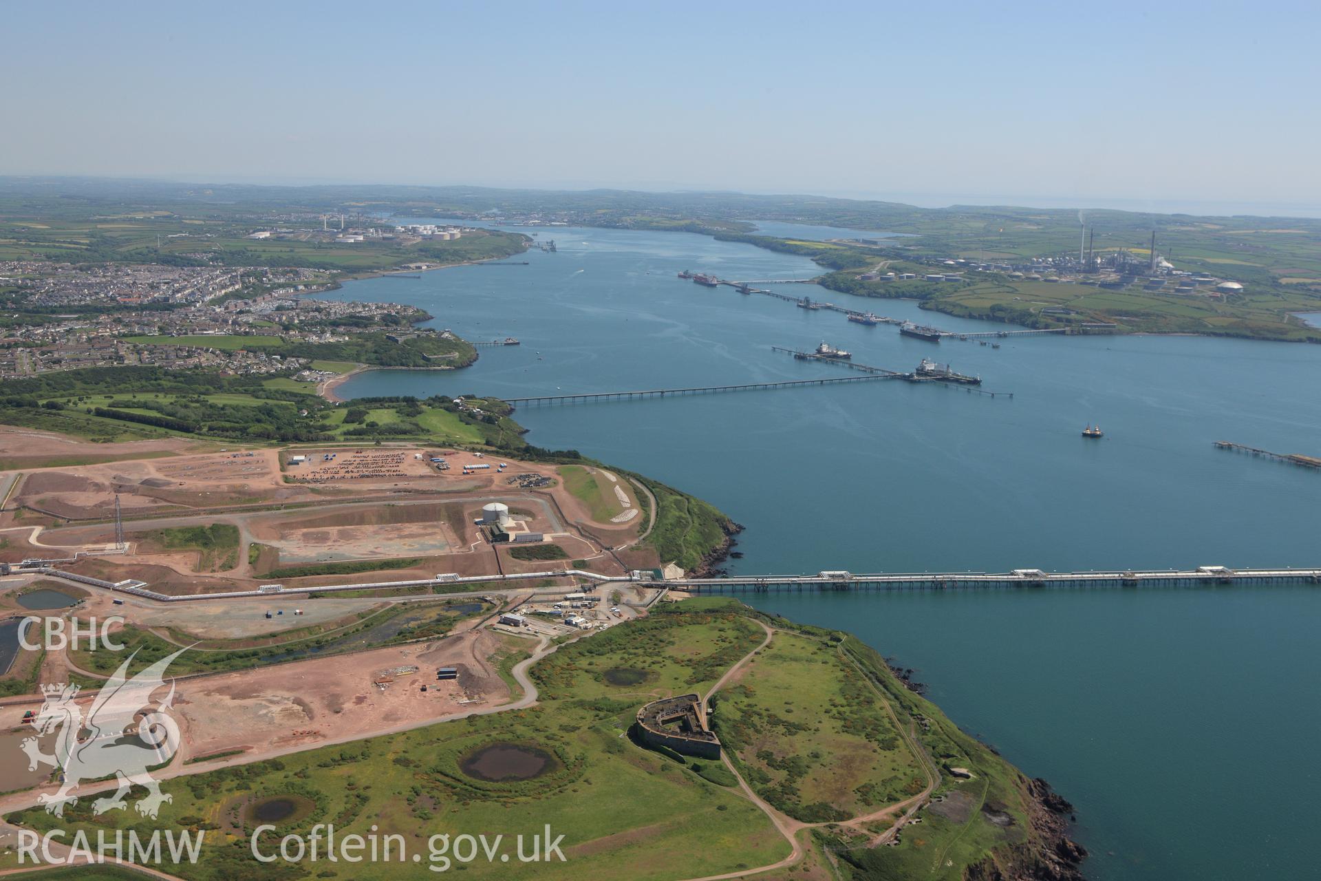 RCAHMW colour oblique aerial photograph of Esso South Hook Oil Refinery and liquid natural gas facility, Milford Haven. Taken on 01 June 2009 by Toby Driver