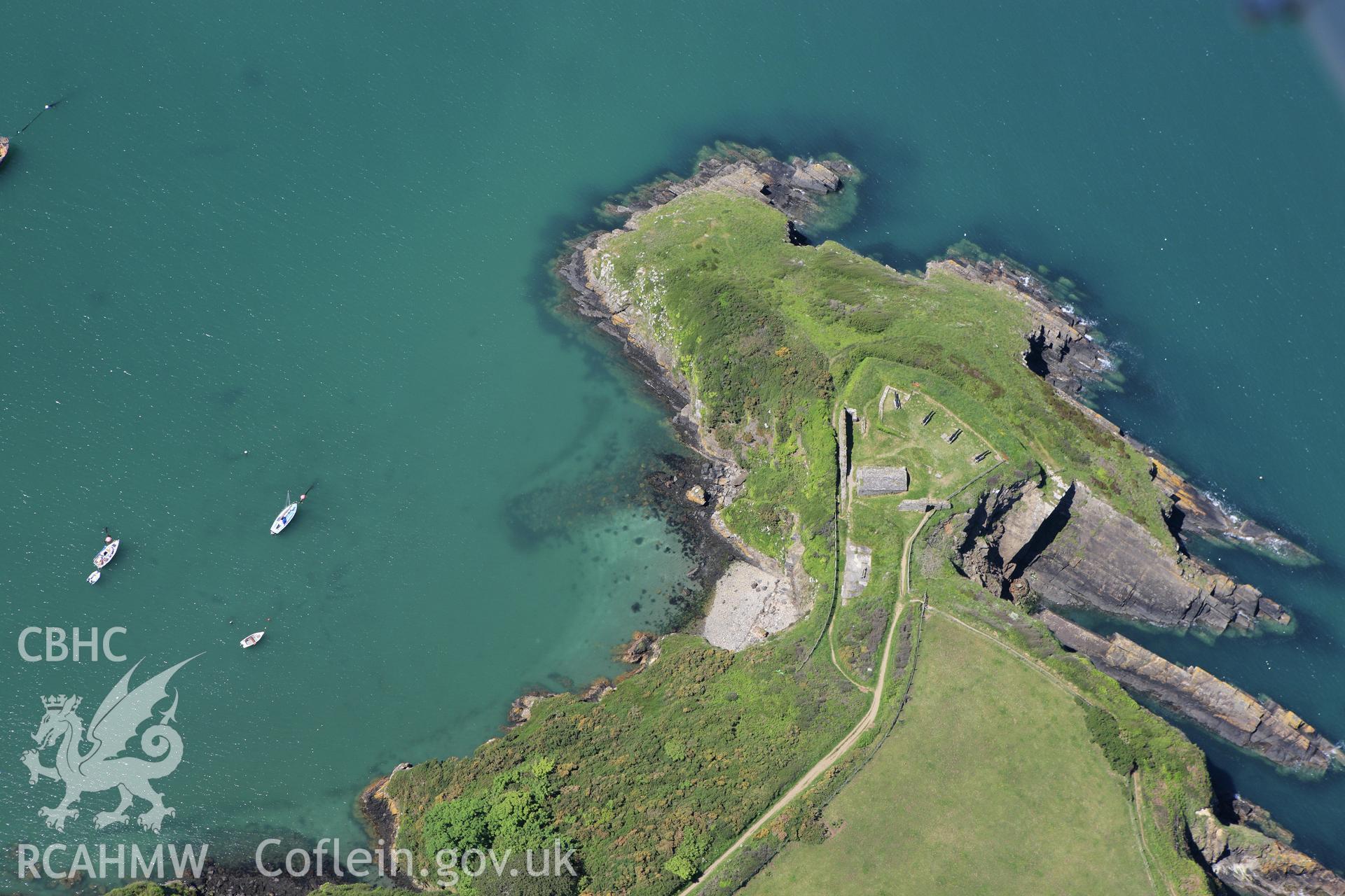 RCAHMW colour oblique aerial photograph of Castle Point Old Fort. Taken on 01 June 2009 by Toby Driver