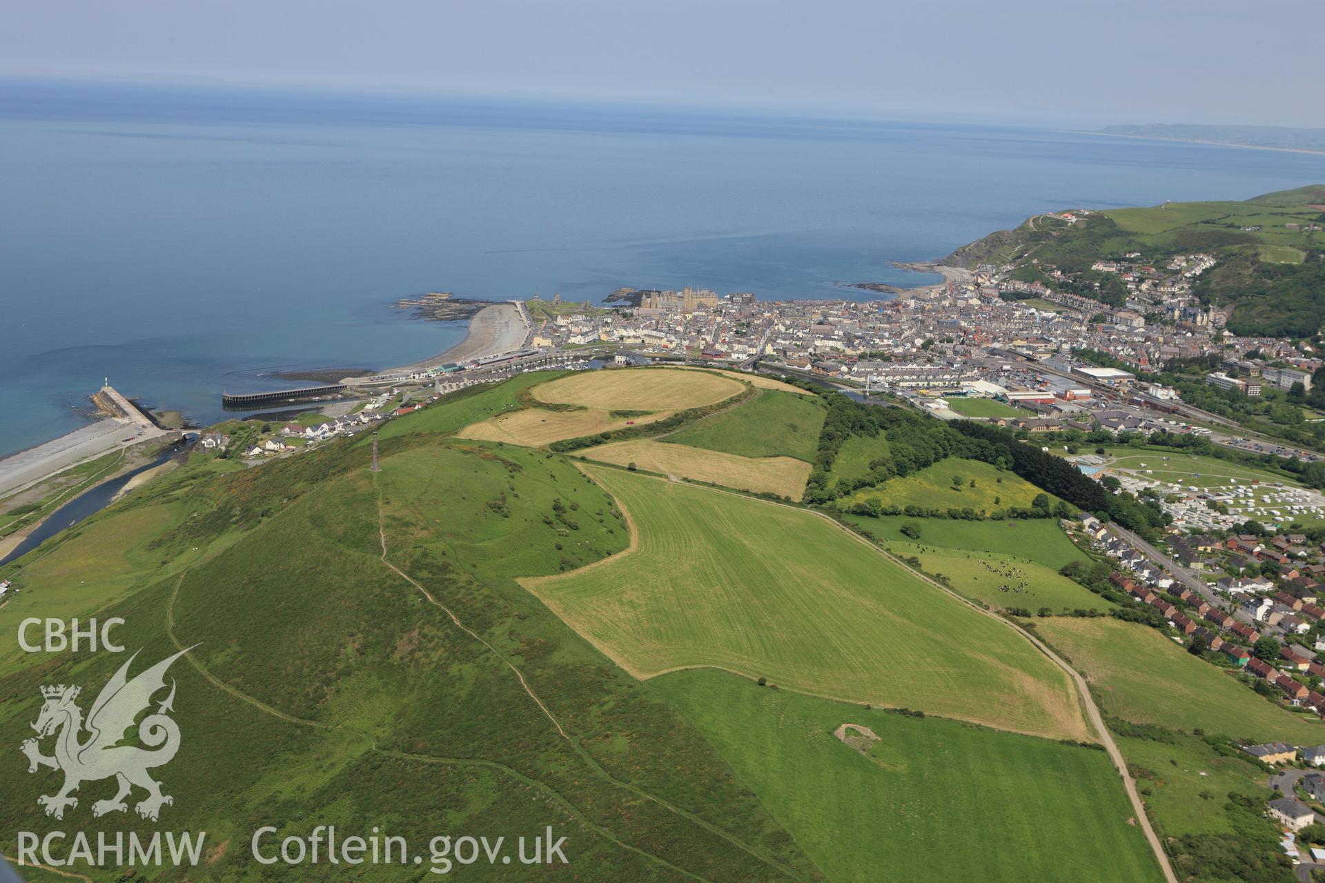 RCAHMW colour oblique aerial photograph of Pen Dinas Hillfort, Aberystwyth. Taken on 02 June 2009 by Toby Driver