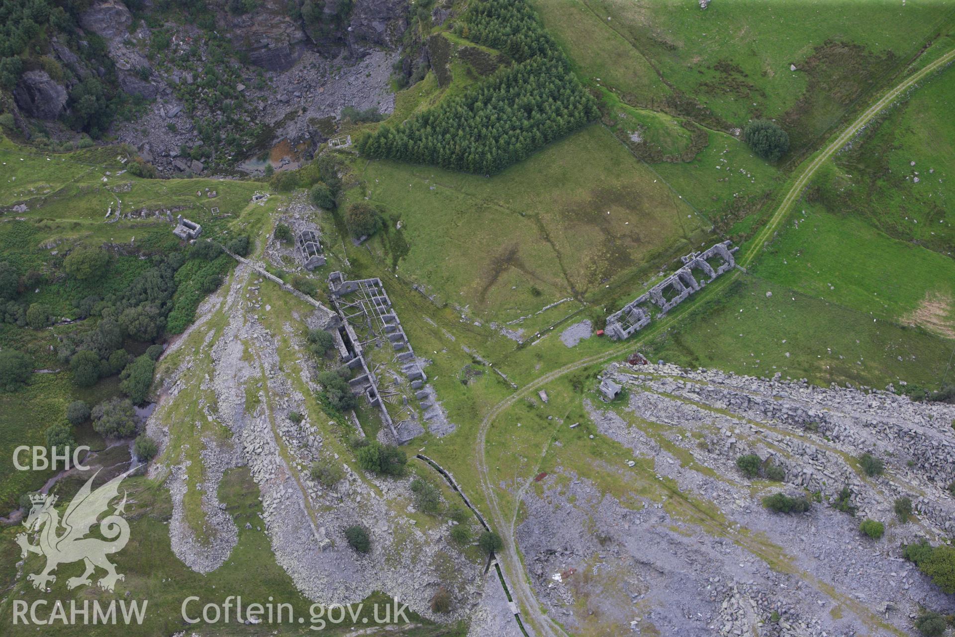 RCAHMW colour oblique aerial photograph of Rhos Quarry (Slate and Slab Works), Capel Curig. Taken on 06 August 2009 by Toby Driver