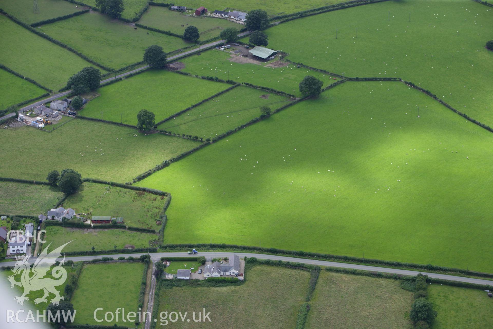 RCAHMW colour oblique aerial photograph of Plas Newydd Round Barrow. Taken on 30 July 2009 by Toby Driver