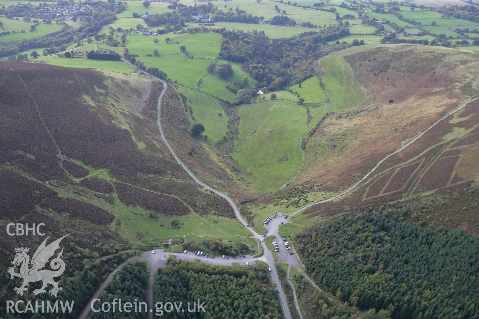 RCAHMW colour oblique aerial photograph of Foel Fenlli Hillfort showing the car park. Taken on 13 October 2009 by Toby Driver