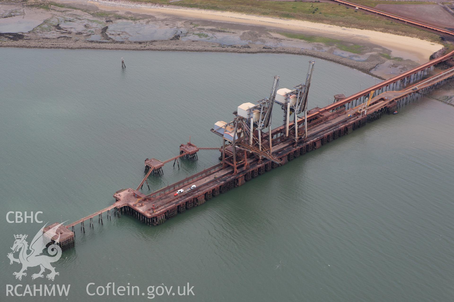 RCAHMW colour oblique aerial photograph of Port Talbot Docks showing cranes. Taken on 09 July 2009 by Toby Driver