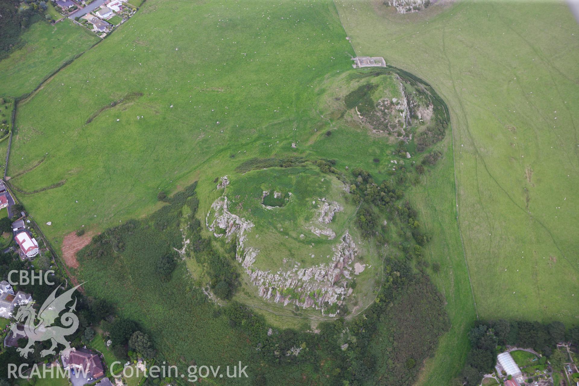 RCAHMW colour oblique aerial photograph of Deganwy Castle. Taken on 06 August 2009 by Toby Driver