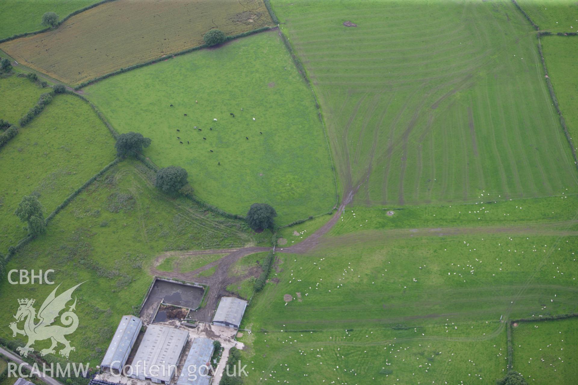 RCAHMW colour oblique aerial photograph of Llynfanod Round Barrow. Taken on 30 July 2009 by Toby Driver