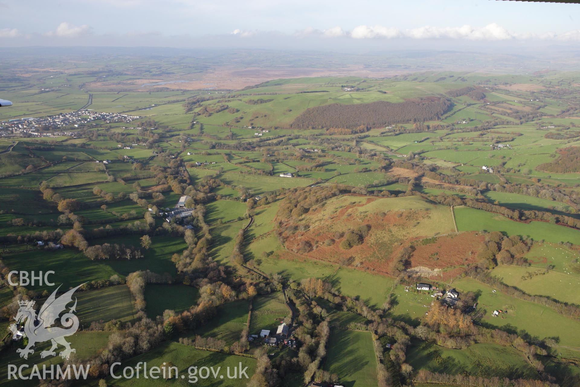 RCAHMW colour oblique aerial photograph of Tregaron and surrounding landscape from the south-east. Taken on 09 November 2009 by Toby Driver