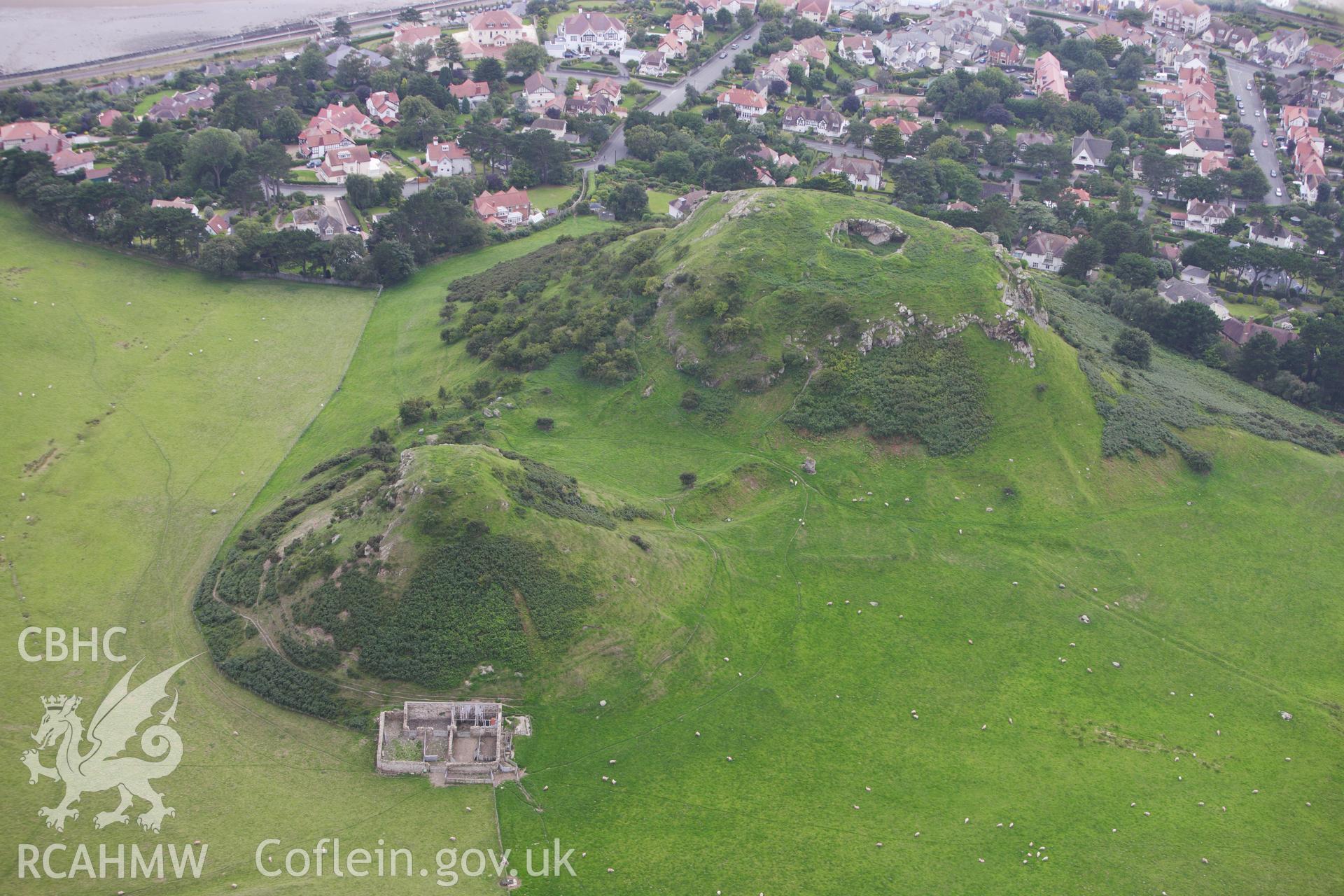 RCAHMW colour oblique aerial photograph of Deganwy Castle. Taken on 06 August 2009 by Toby Driver