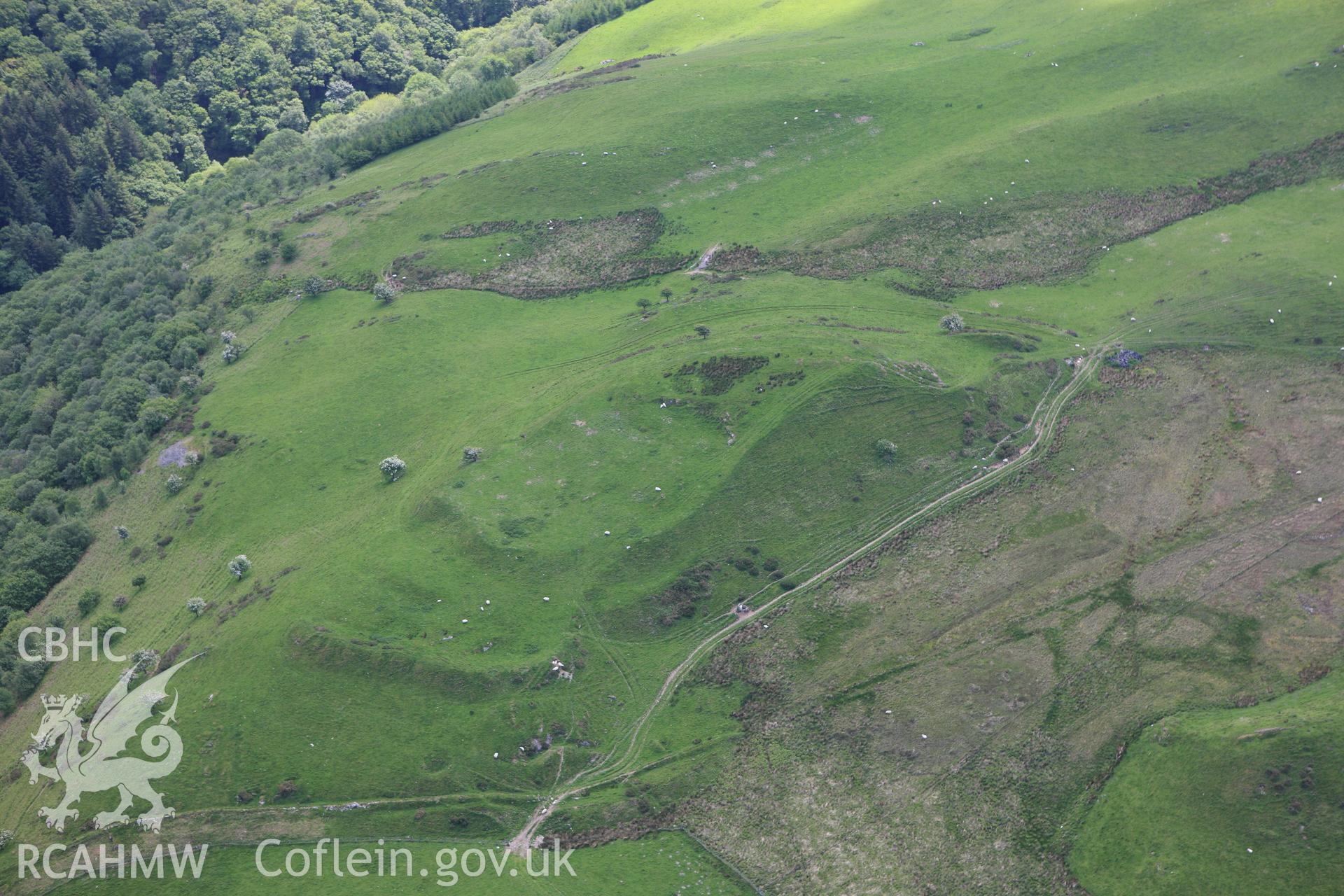 RCAHMW colour oblique aerial photograph of Pen Dinas. Taken on 02 June 2009 by Toby Driver