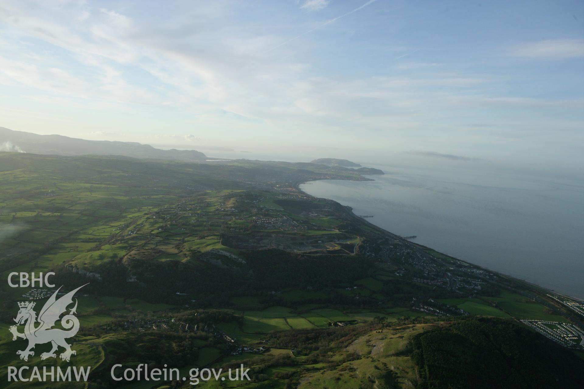 RCAHMW colour oblique aerial photograph of Colwyn Bay and surrounding landscape from the east. Taken on 10 December 2009 by Toby Driver