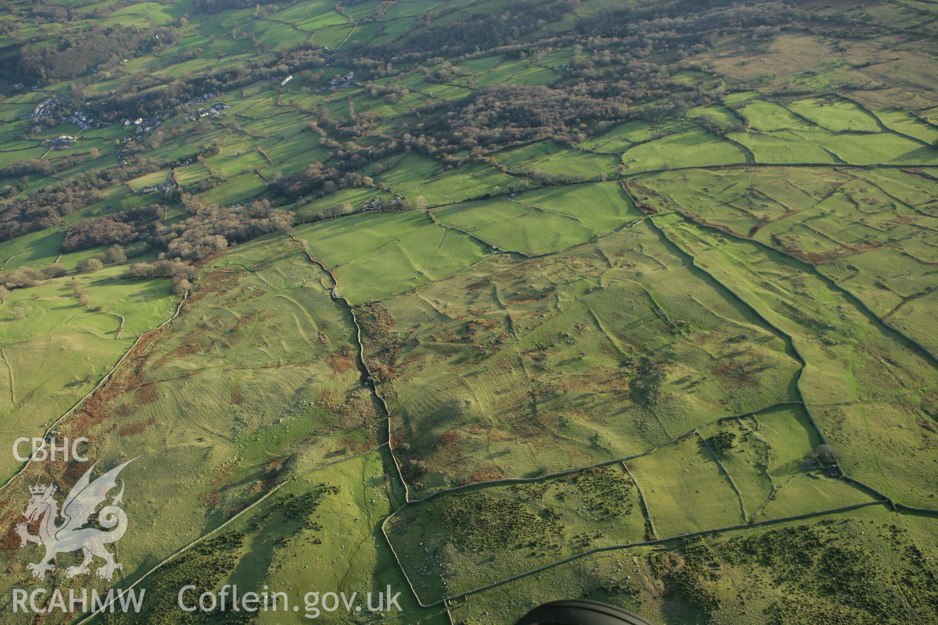 RCAHMW colour oblique aerial photograph of Maen-y-Bardd Settlement and field systems. Taken on 10 December 2009 by Toby Driver