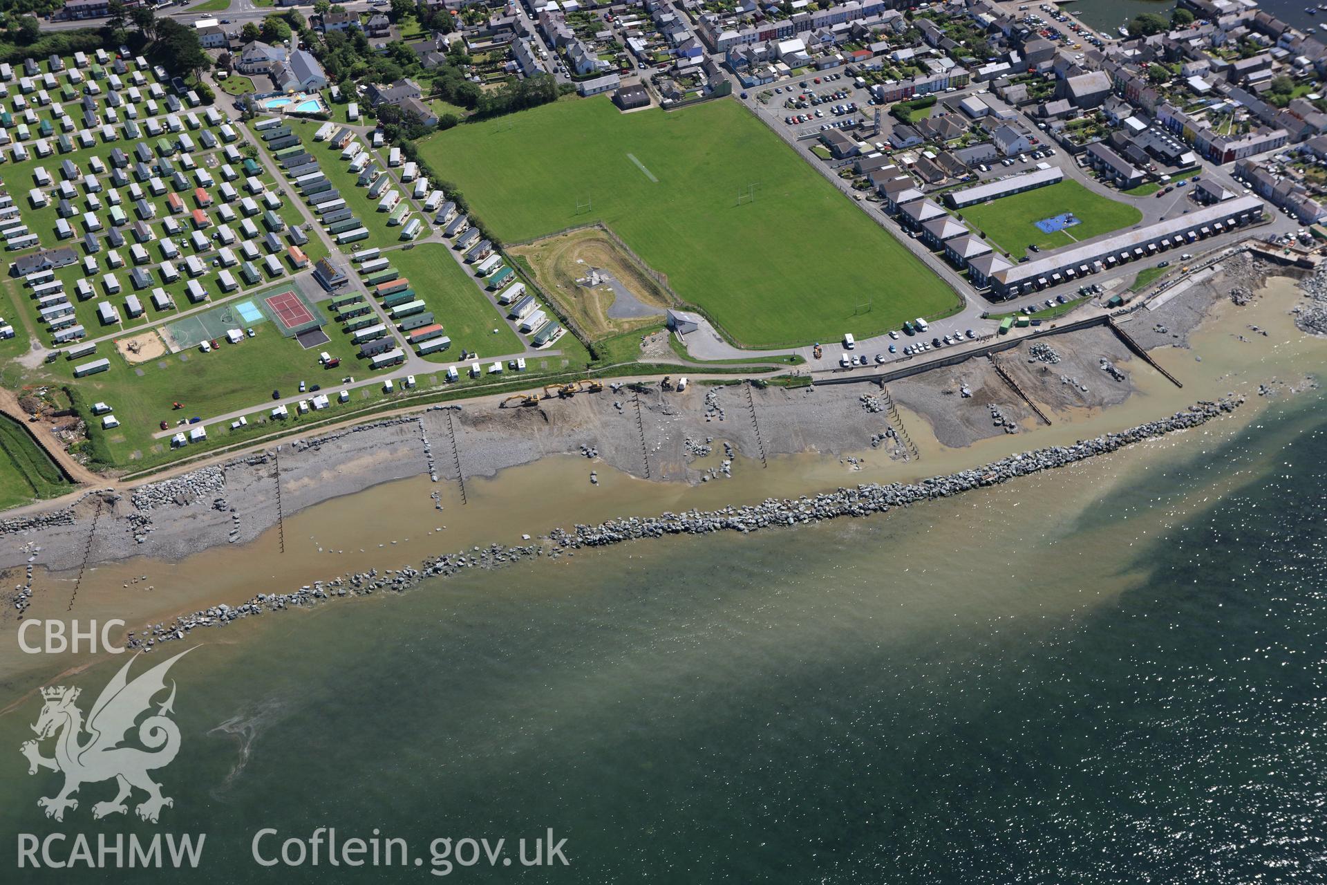 RCAHMW colour oblique aerial photograph of Aberaeron with coastal defence work ongoing. Taken on 01 June 2009 by Toby Driver