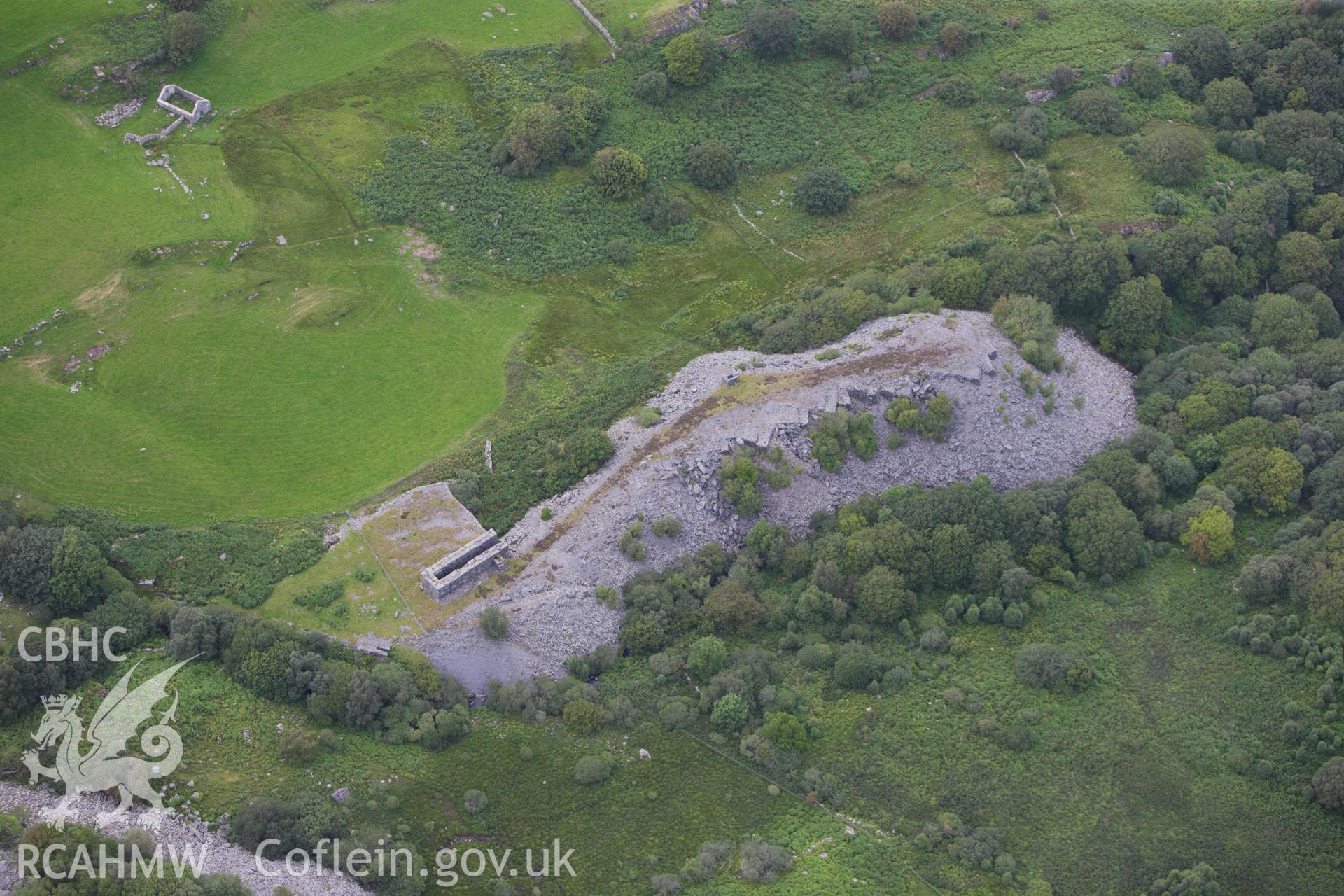 RCAHMW colour oblique aerial photograph of Rhos Quarry (Slate and Slab Works), Capel Curig. Taken on 06 August 2009 by Toby Driver