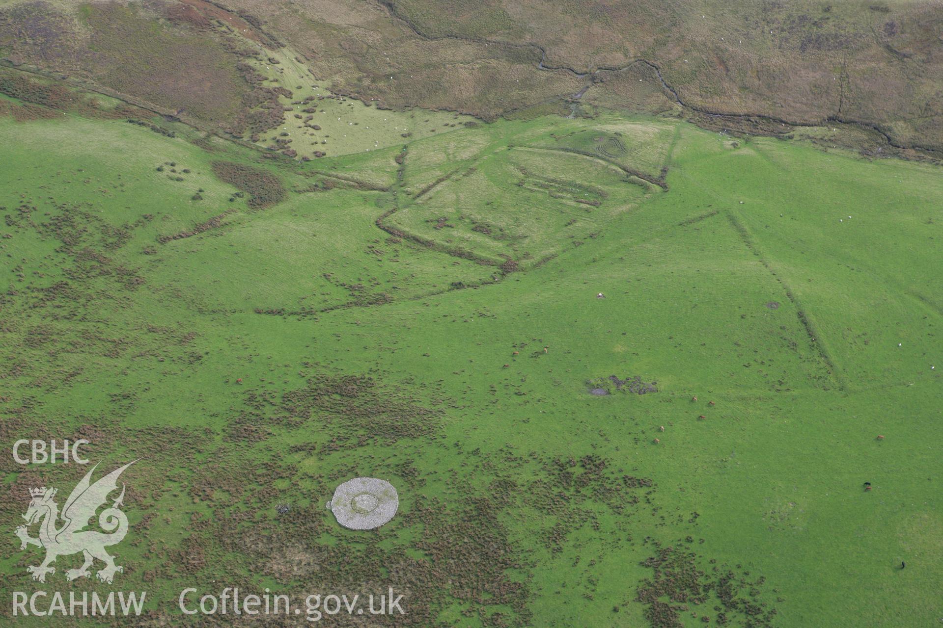 RCAHMW colour oblique aerial photograph of Hen Ddinbych and cairn Taken on 13 October 2009 by Toby Driver