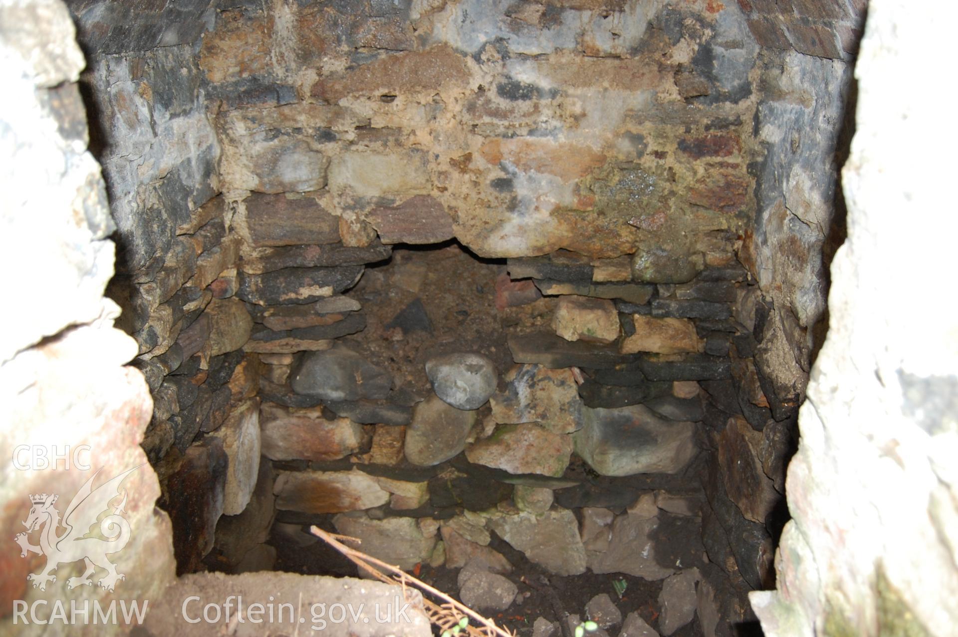 Digital photograph from an archaeological assessment of Deganwy Castle, carried out by Gwynedd Archaeological Trust, 2009. Well/tank.