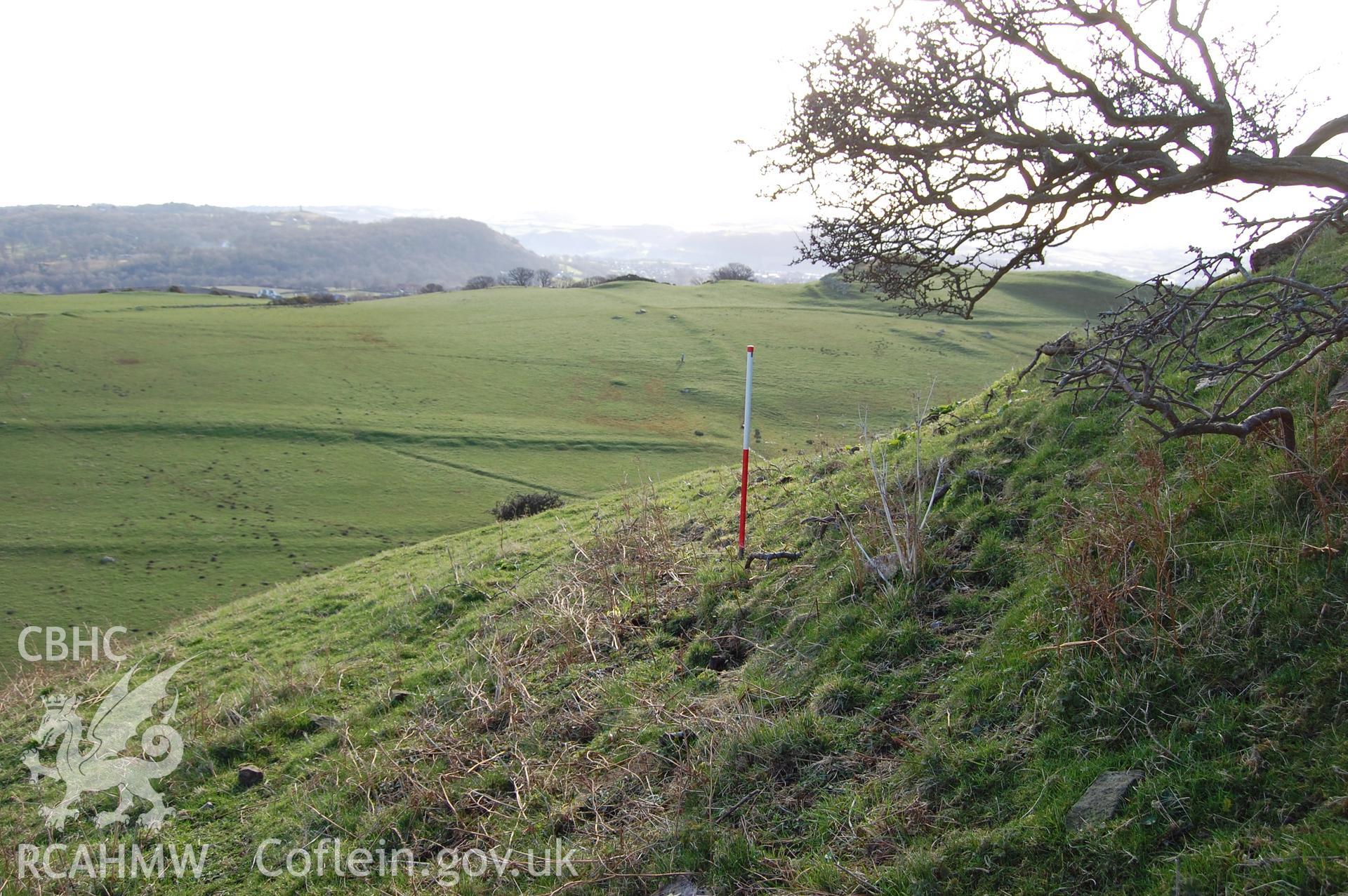 Digital photograph from an archaeological assessment of Deganwy Castle, carried out by Gwynedd Archaeological Trust, 2009. Ditch/platform under Mansel's Tower.