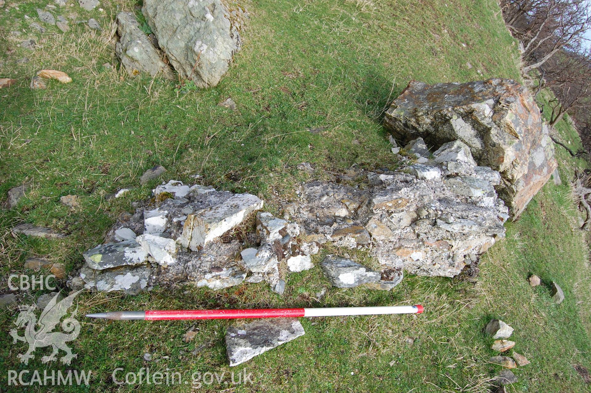 Digital photograph from an archaeological assessment of Deganwy Castle, carried out by Gwynedd Archaeological Trust, 2009. Fallen masonry in quarry below cliff on South side of donjon.