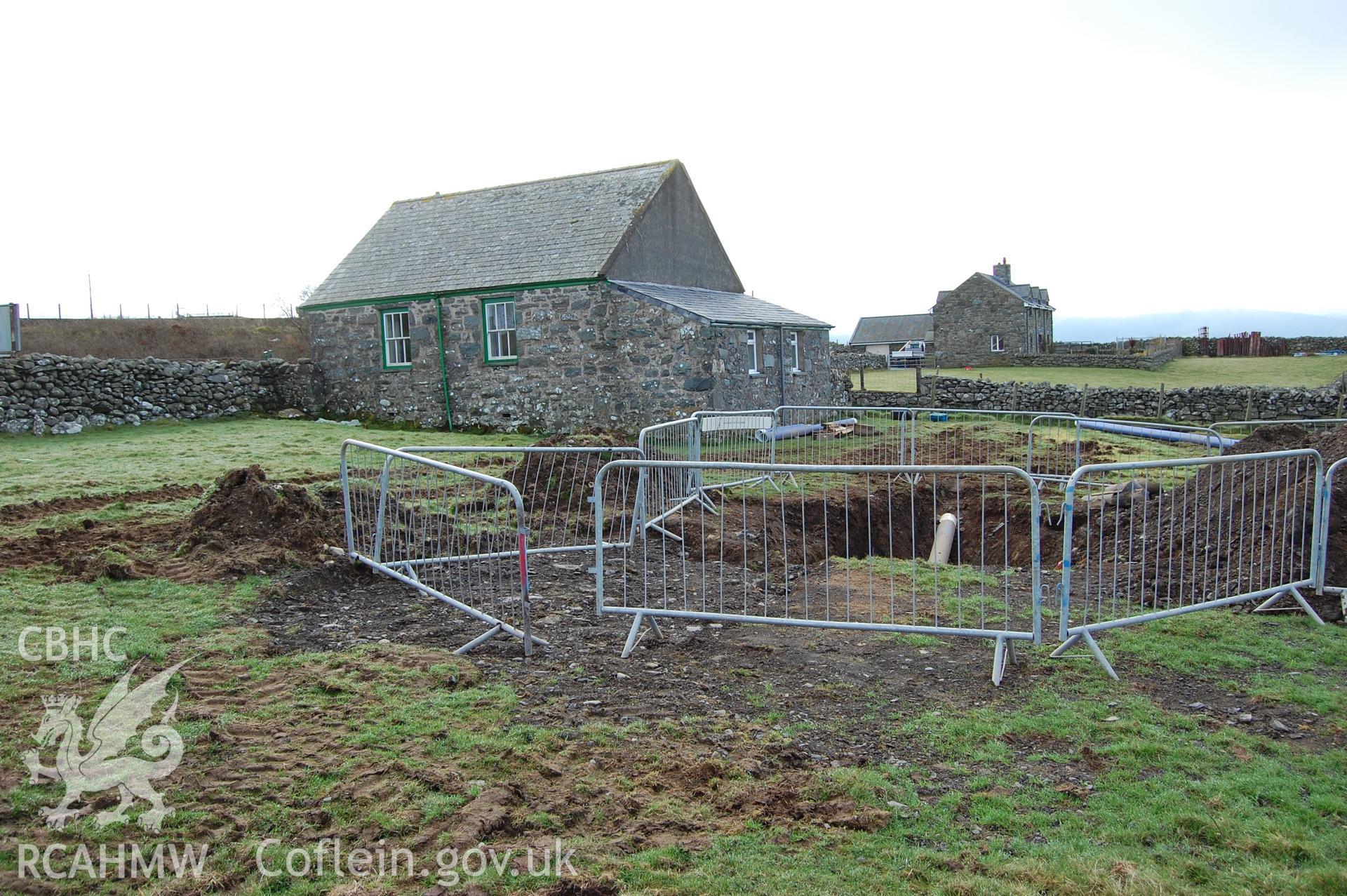 Digitial photograph of pipe bursting hole, from a Gwynedd Archaeological Trust archaeological assessment of a field to the rear of Capel En-gedi, Rhiwgoch, near Harlech.