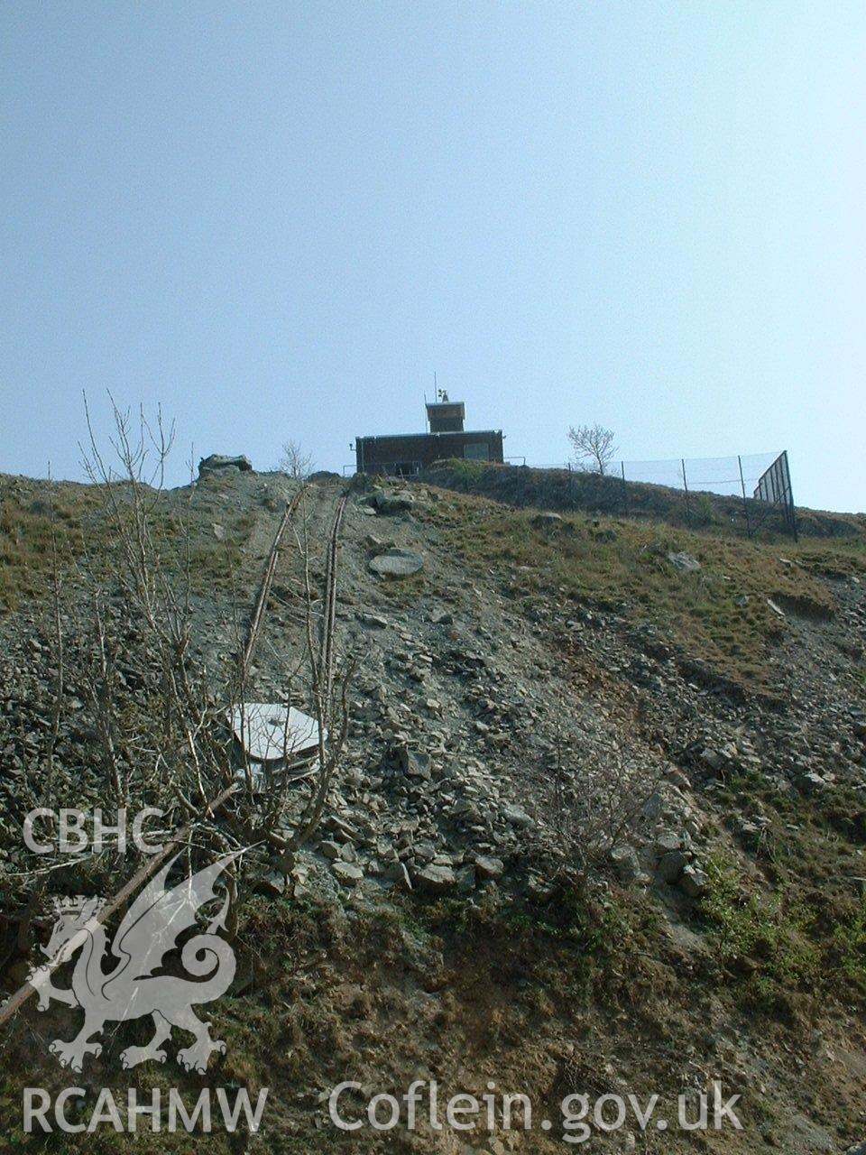 Colour digital photograph showing a winch house and pulley block.