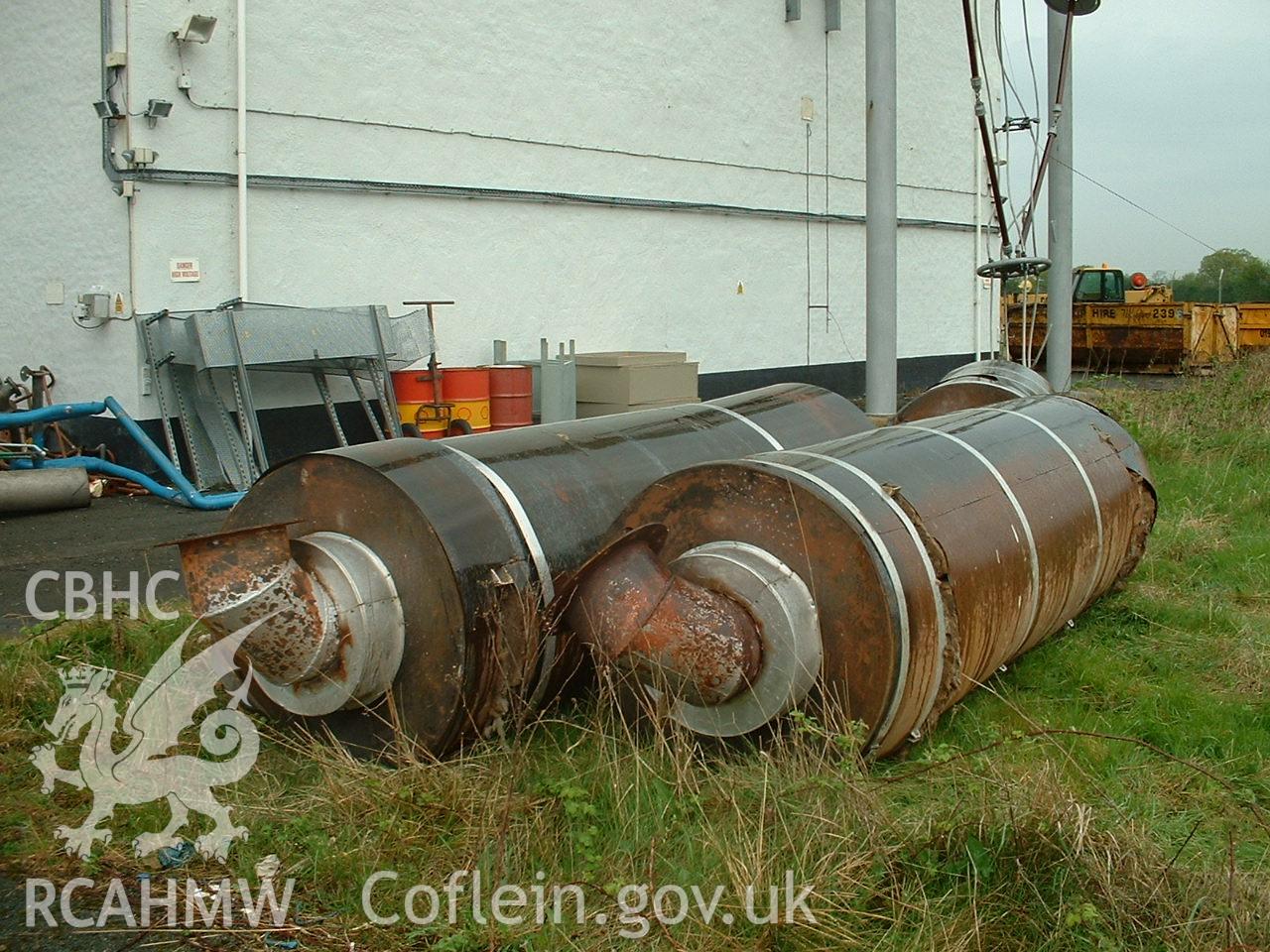 Colour digital photograph of silencers being removed.