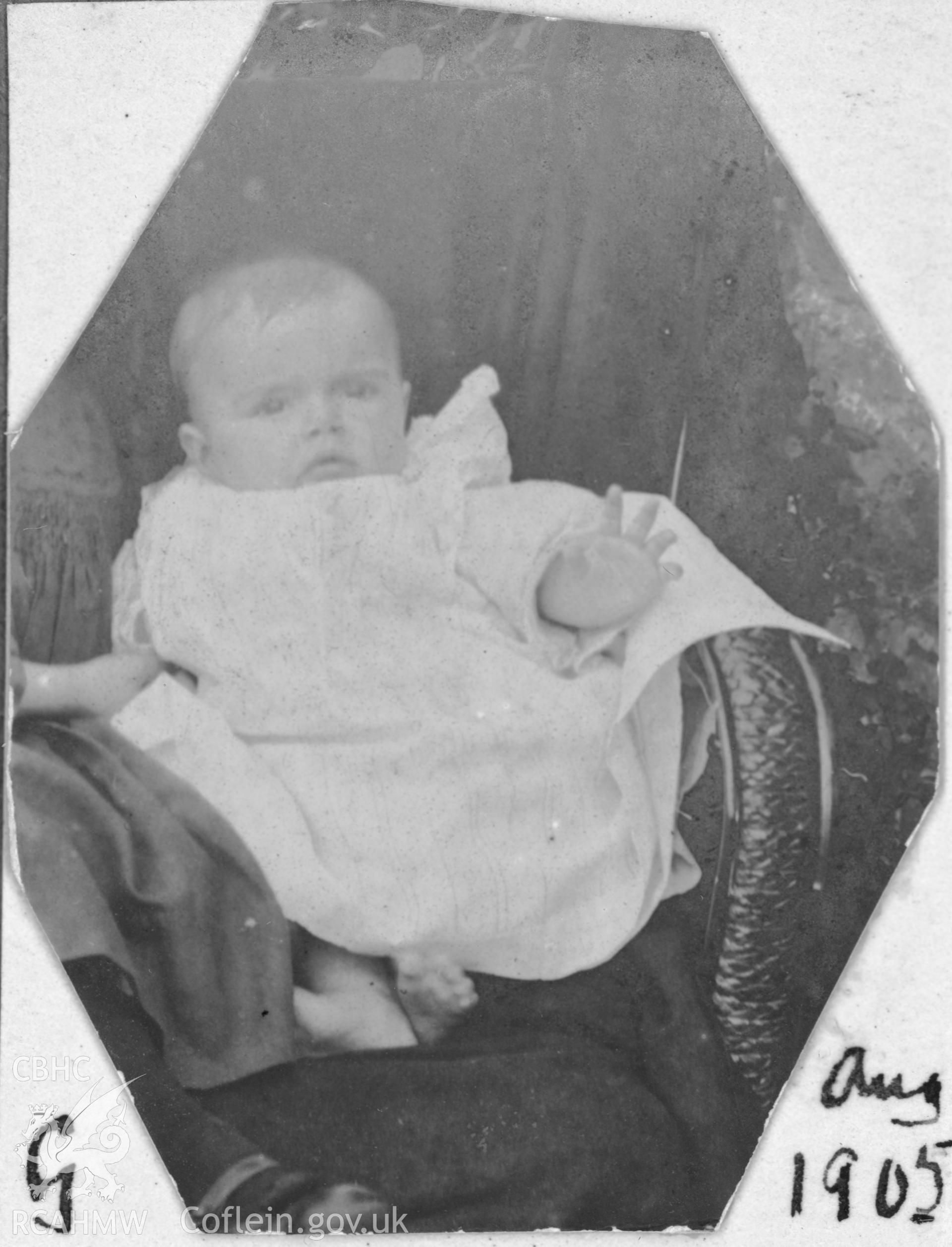 "G. August 1905". Photo of baby. Digitised from a photograph album showing views of Aberystwyth and District, produced by David John Saer, school teacher of Aberystwyth. Loaned for copying by Dr Alan Chamberlain.