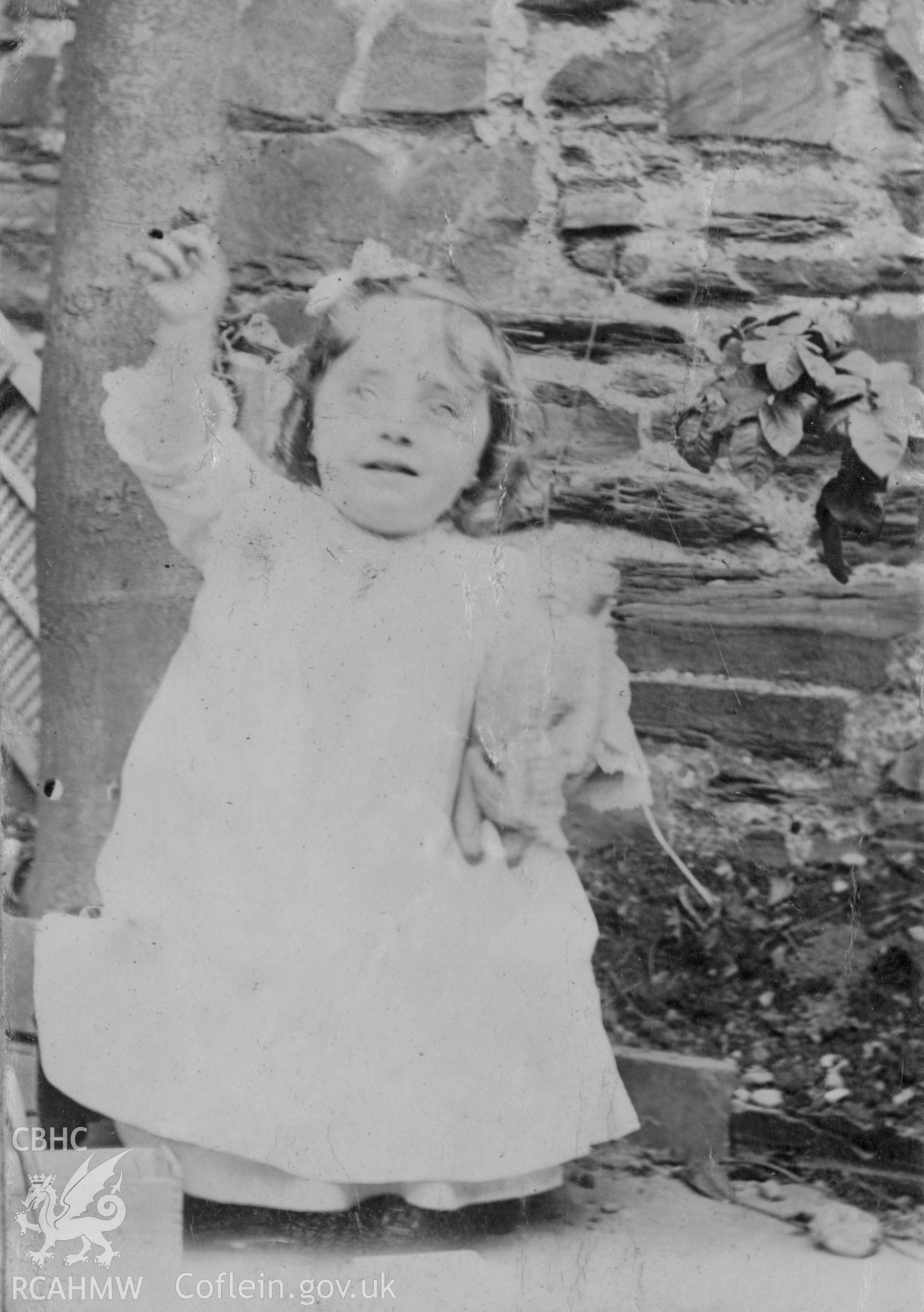 "1904". Photo of a small child. Digitised from a photograph album showing views of Aberystwyth and District, produced by David John Saer, school teacher of Aberystwyth. Loaned for copying by Dr Alan Chamberlain.