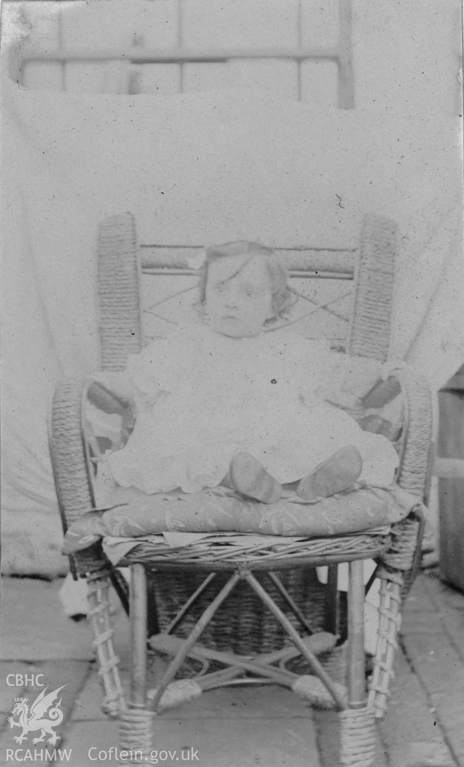 'At Pontardulais 1903',  photo showing a seated child. Digitised from a photograph album showing views of Aberystwyth and District, produced by David John Saer, school teacher of Aberystwyth. Loaned for copying by Dr Alan Chamberlain.