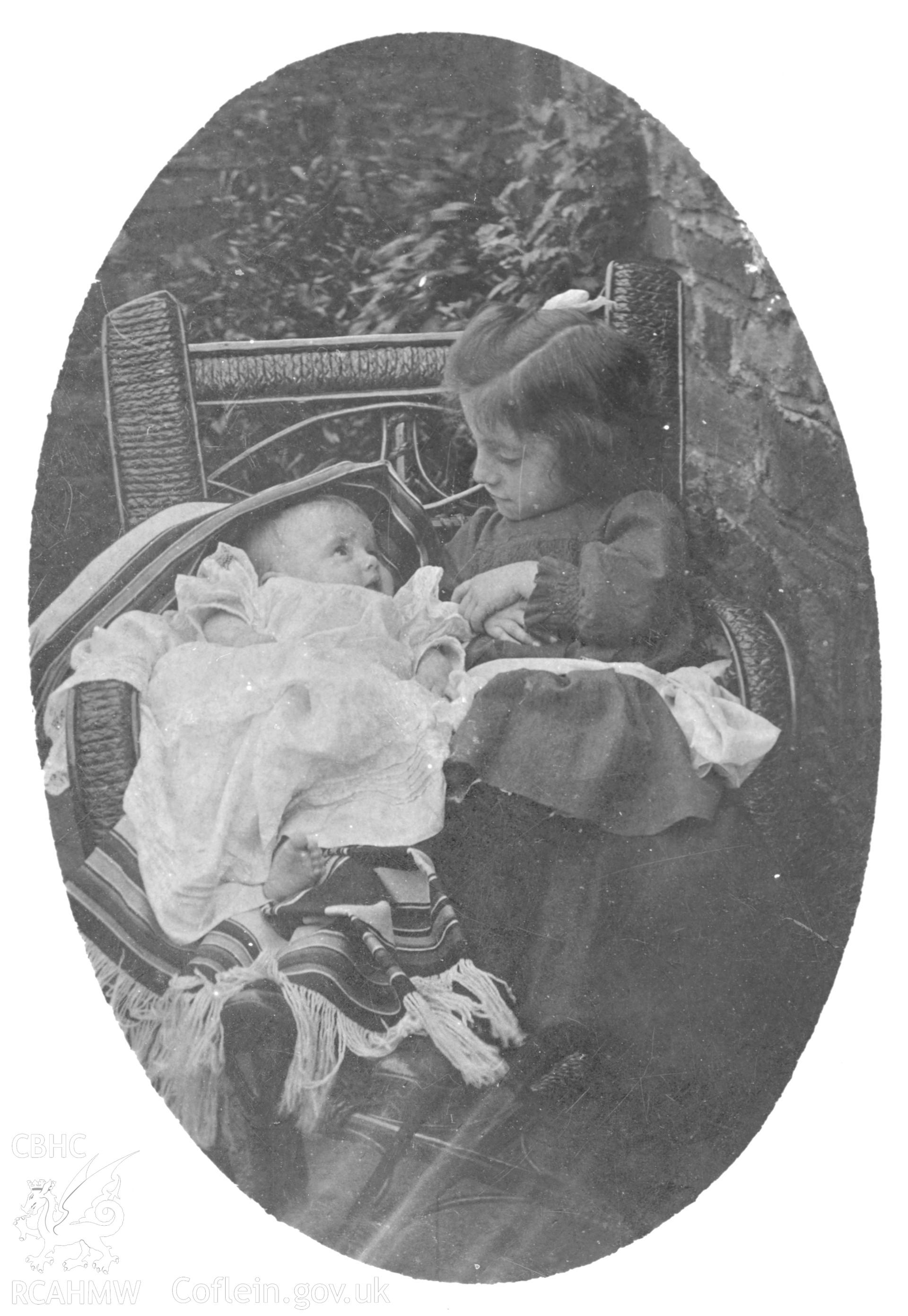 "At Llanelly 1905". Photo of a seated child and baby. Digitised from a photograph album showing views of Aberystwyth and District, produced by David John Saer, school teacher of Aberystwyth. Loaned for copying by Dr Alan Chamberlain.