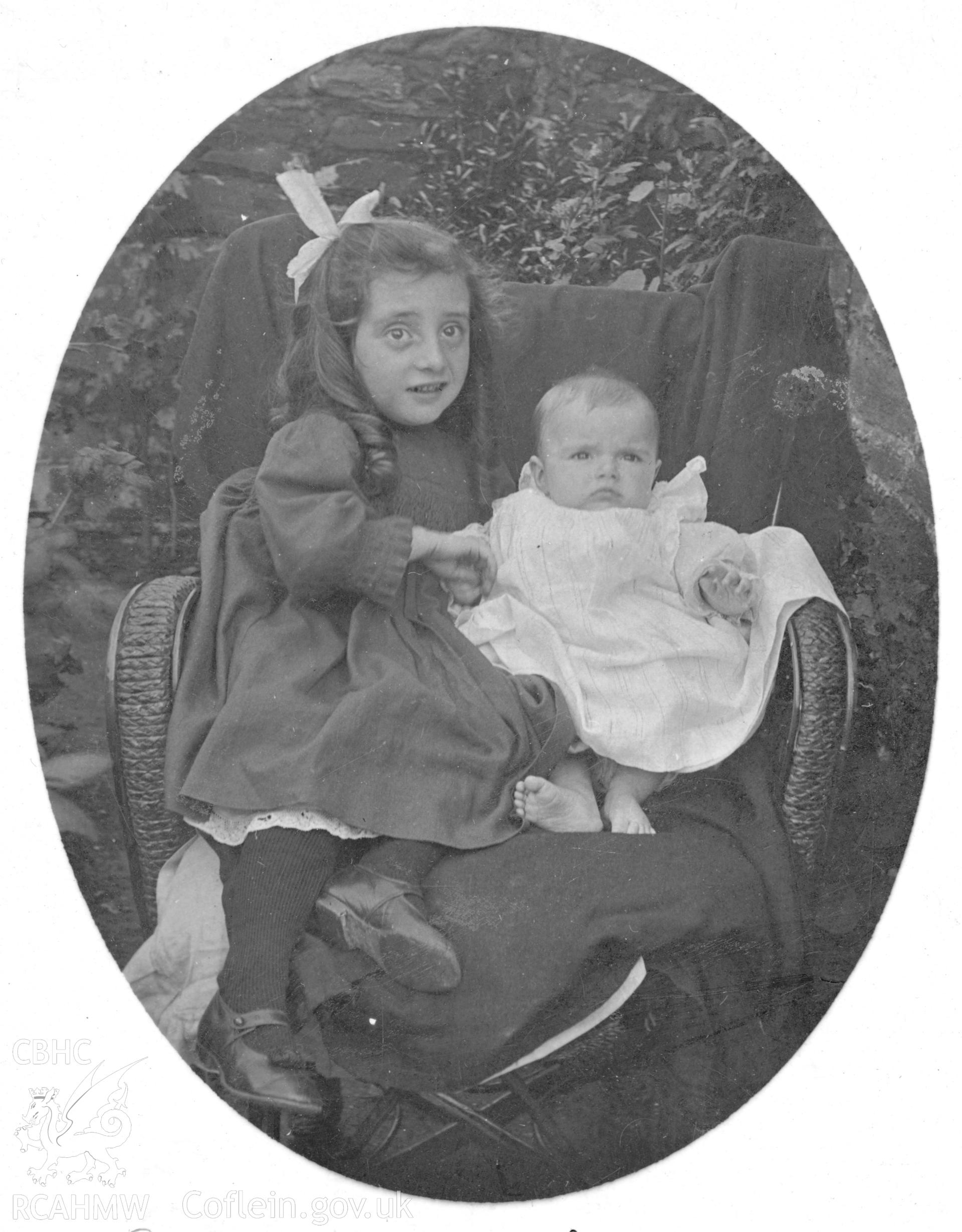 "At Llanelly 1905". Photo of a seated child and baby. Digitised from a photograph album showing views of Aberystwyth and District, produced by David John Saer, school teacher of Aberystwyth. Loaned for copying by Dr Alan Chamberlain.