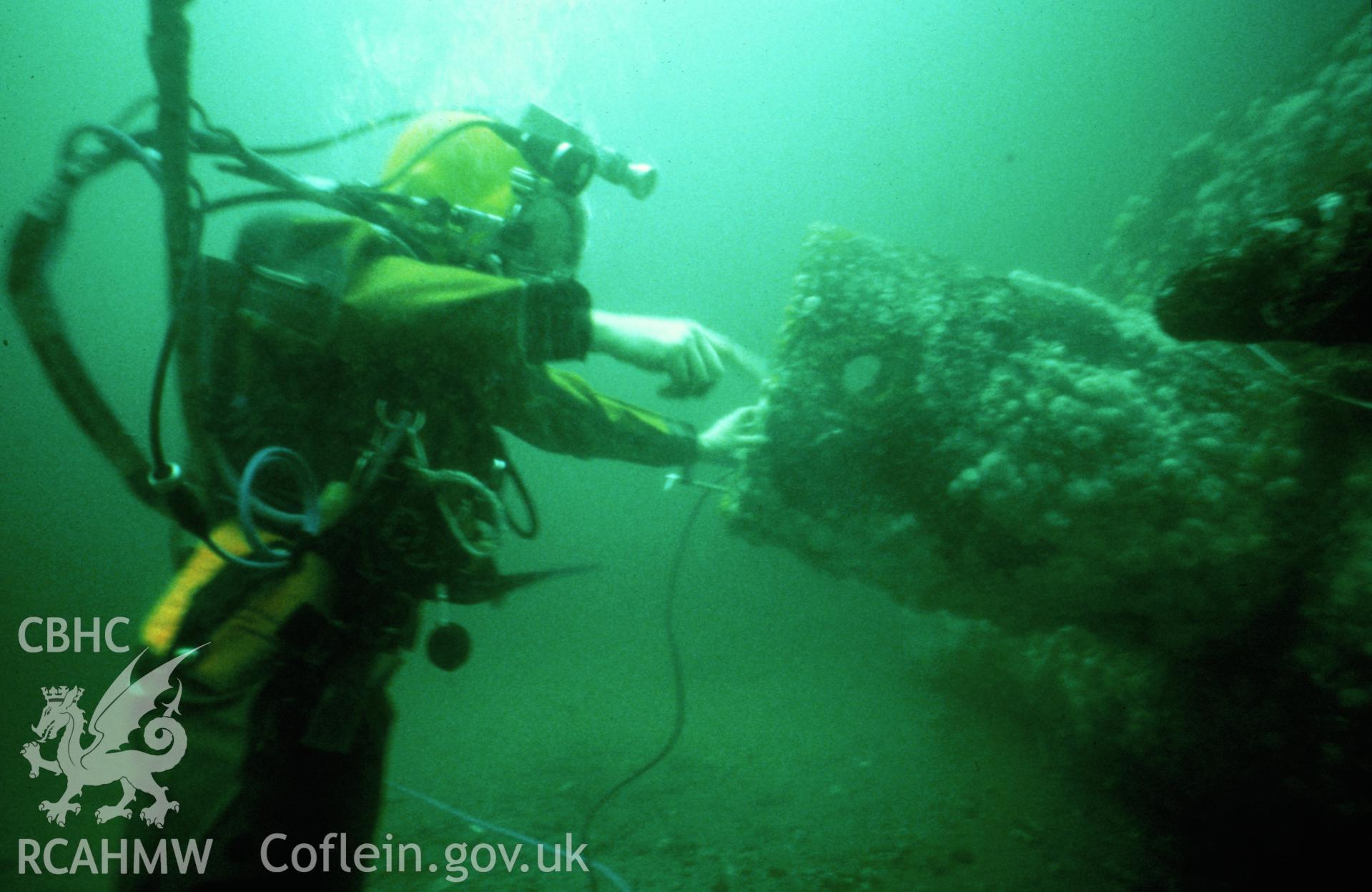 Colour slide. ADU diver inspects interior of conning tower.