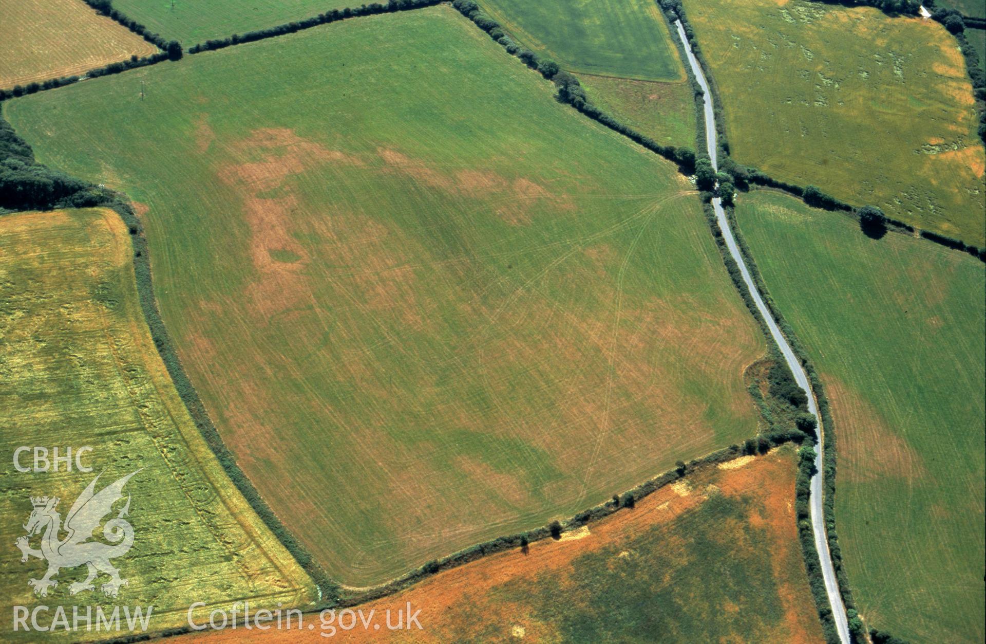 RCAHMW colour slide oblique aerial photograph of cropmark features NE of Dryslwyn, Nevern, taken by C.R.Musson on the 25/07/1996