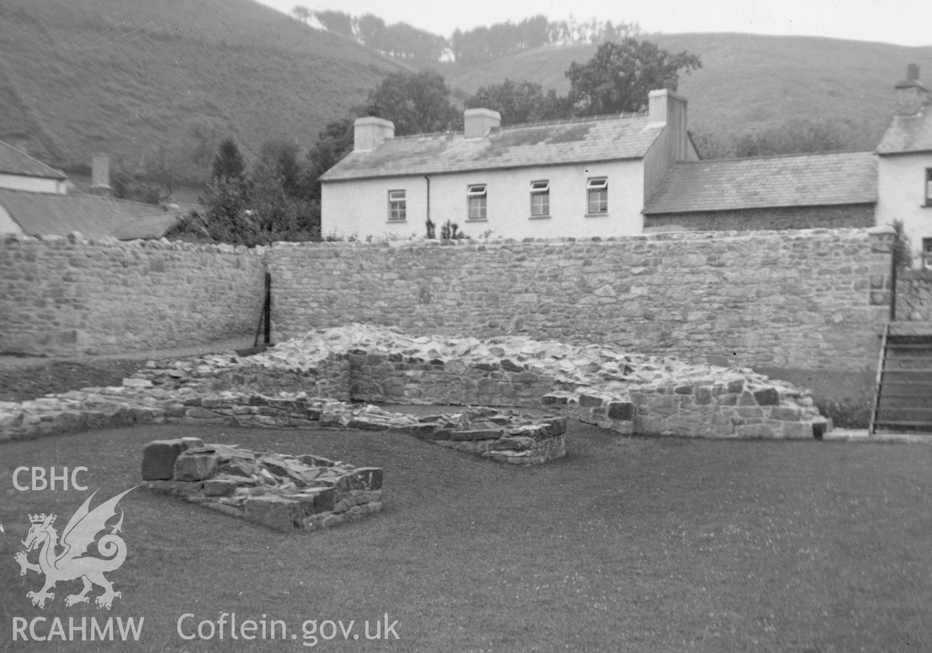 View of surrounding wall and consolidated wall foundations at Talley Abbey.