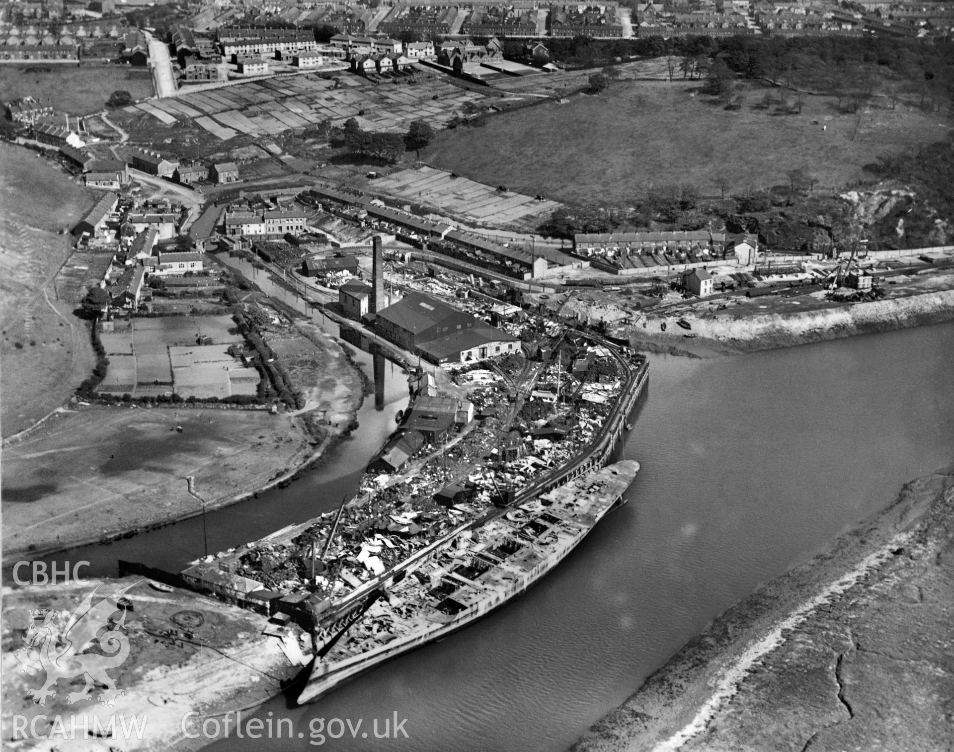 Black and white oblique aerial photograph showing Giant's Grave Dock, Briton Ferry, from Aerofilms album no W18 (Glamorgan A-B), taken by Aerofilms Ltd and dated 1921.