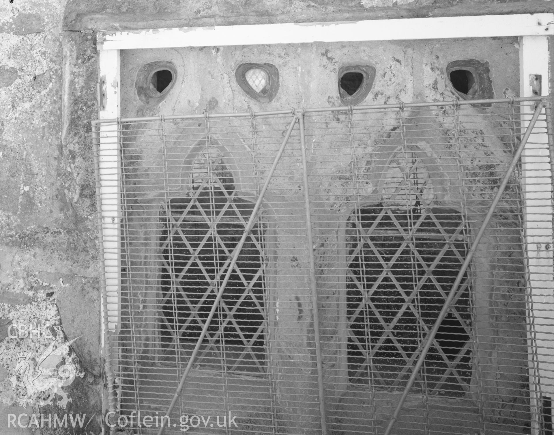 Black and white acetate negative showing a window at St Tanwg's Church.