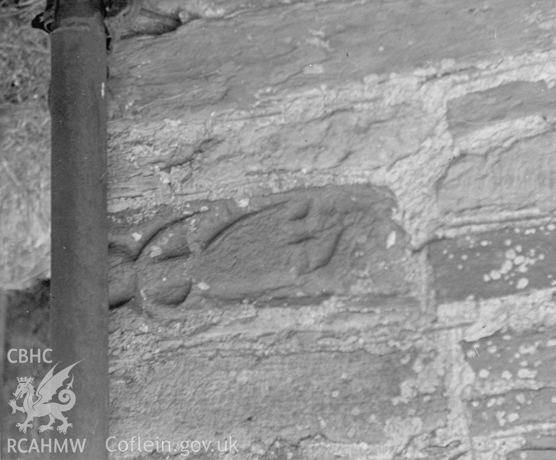 Detail of carved figure in exterior wall of St Michael's Church, Bryngwyn.  Dated 1947.