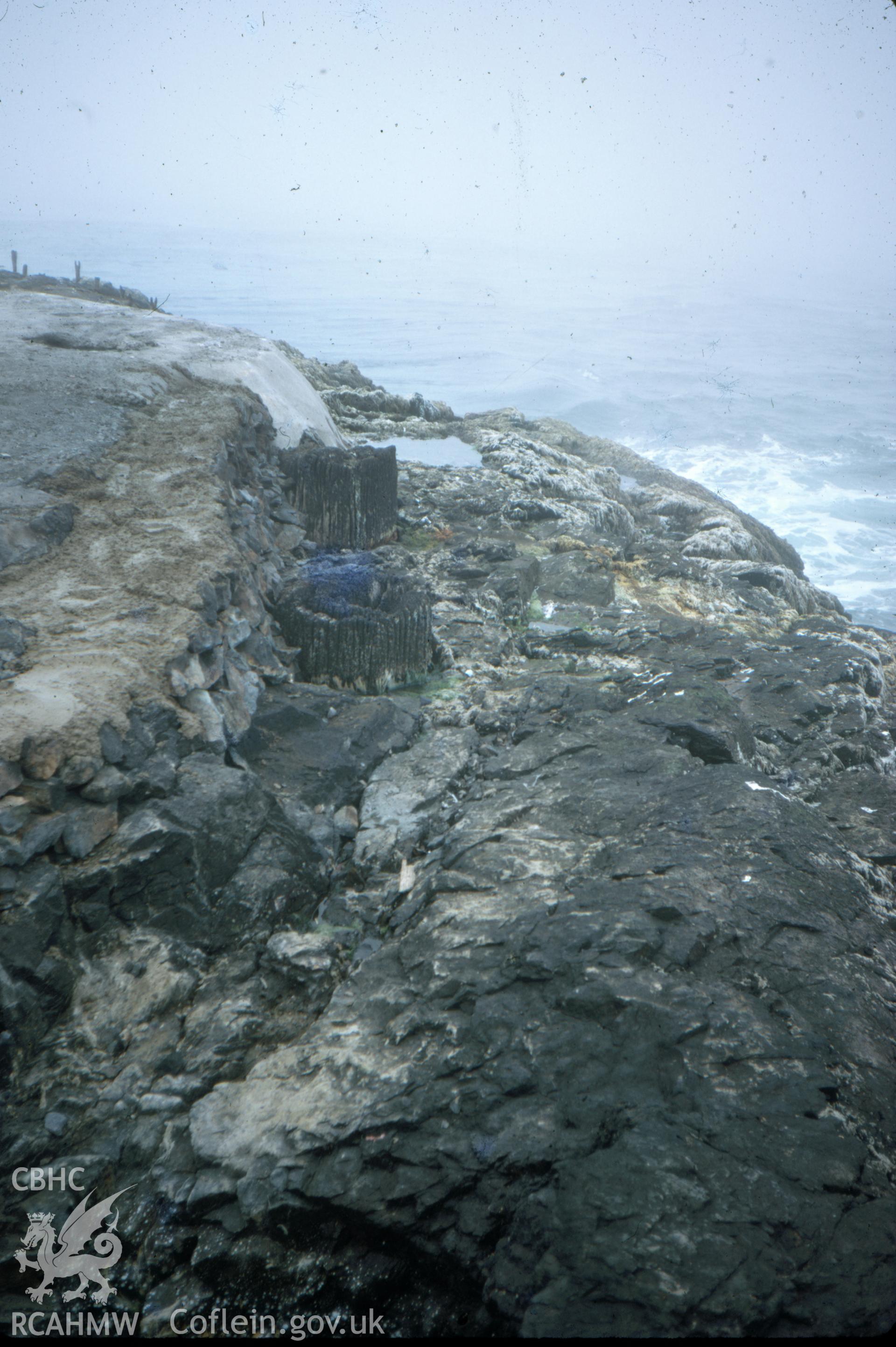 Colour slide showing posts of the wooden lighthouse.