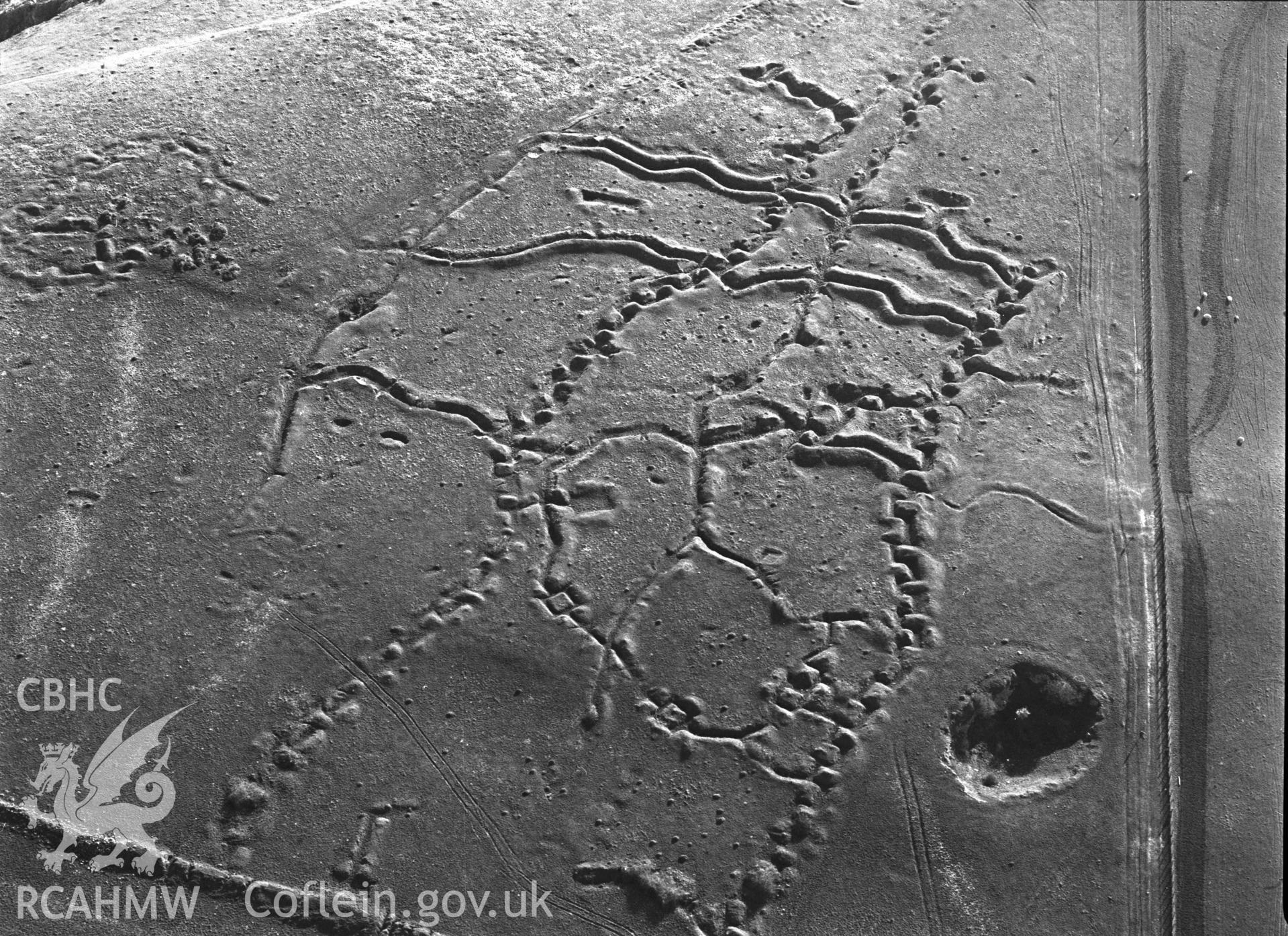 RCAHMW black and white oblique aerial photograph of Penally WWI practice trench system. Taken by C R Musson on 13/04/1995
