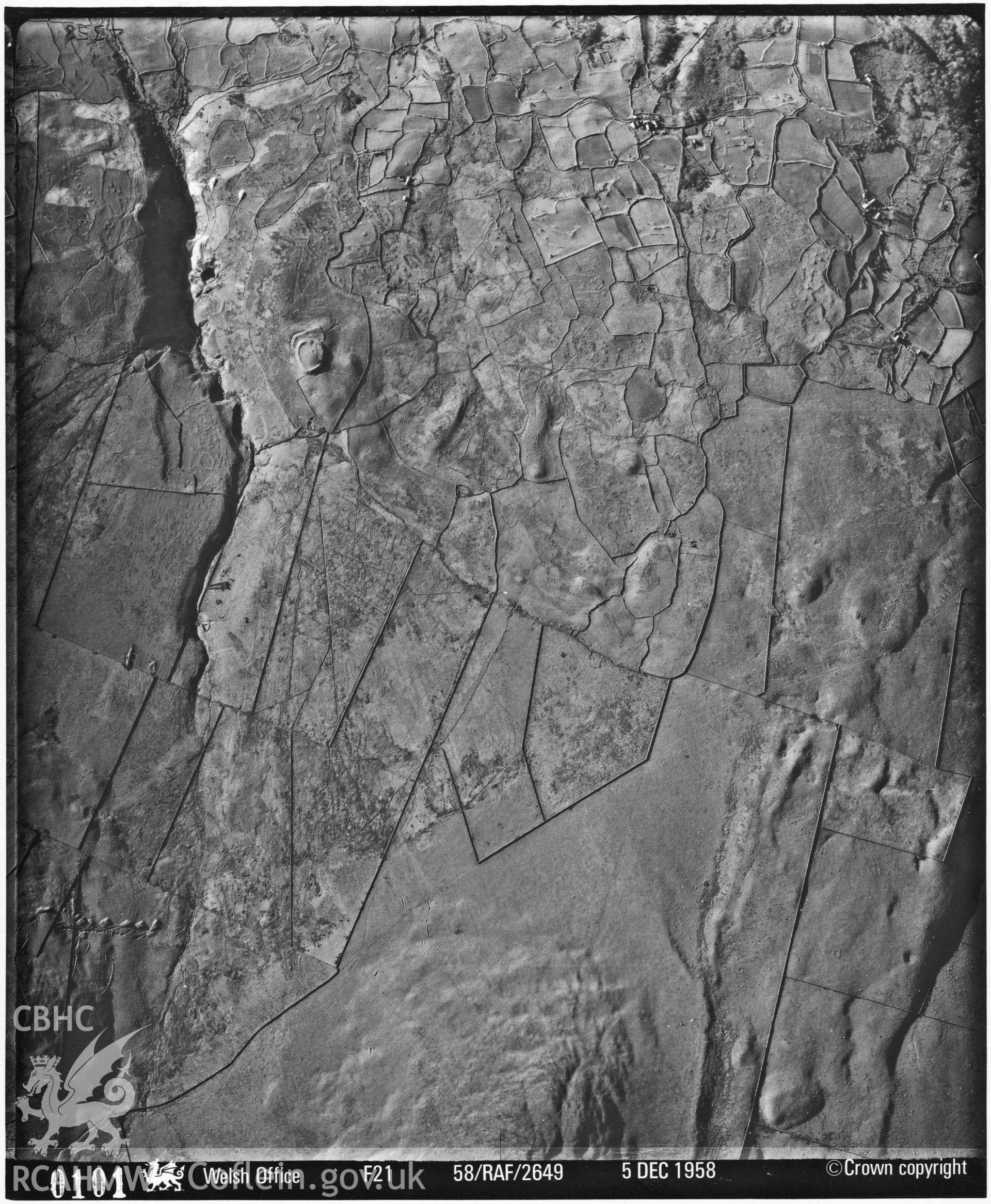 Black and white vertical aerial photograph showing Pen y Dinas, taken by the RAF 1958.
