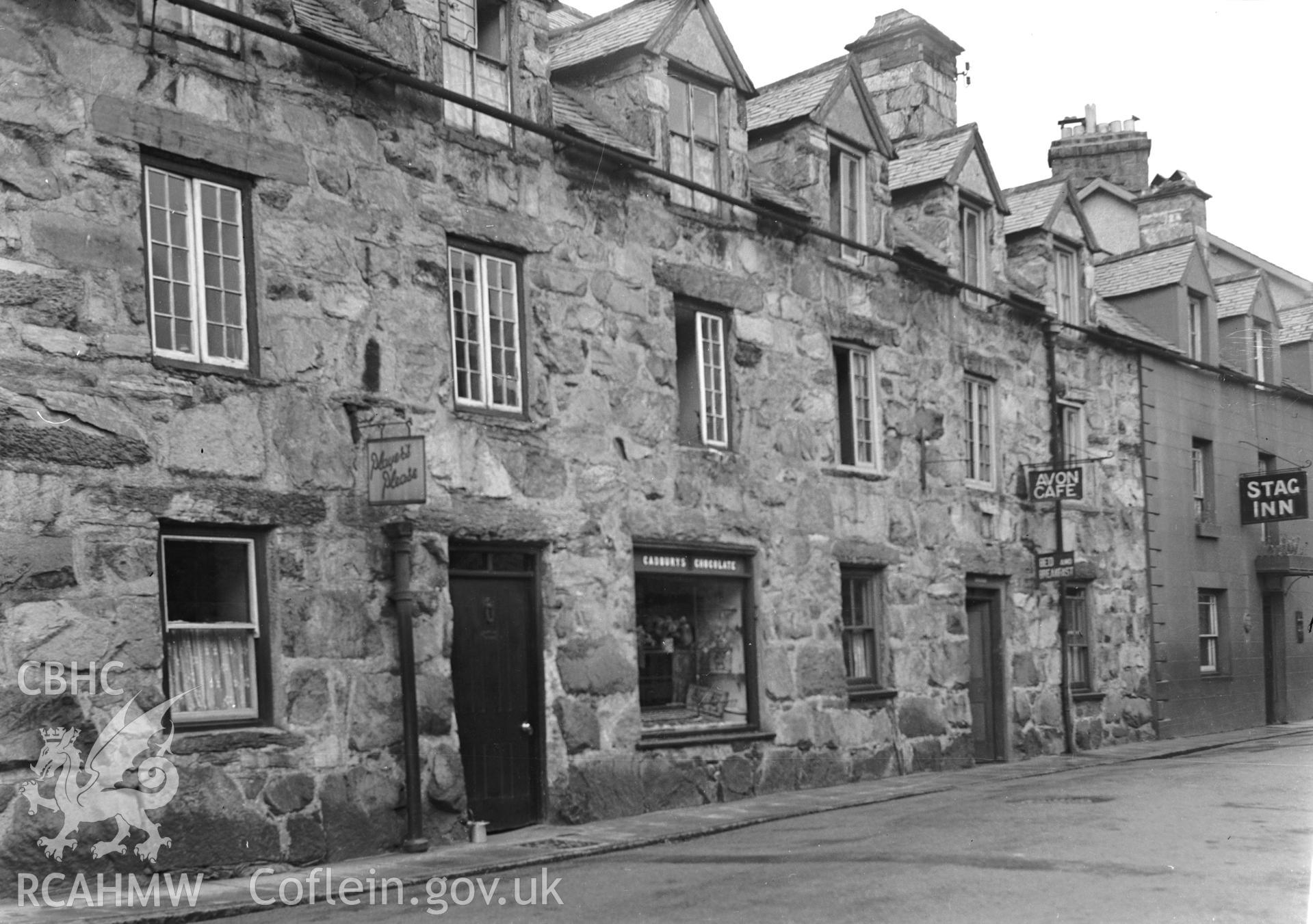 Black and white print showing a house in Dolgellau, Merioneth. Negative held