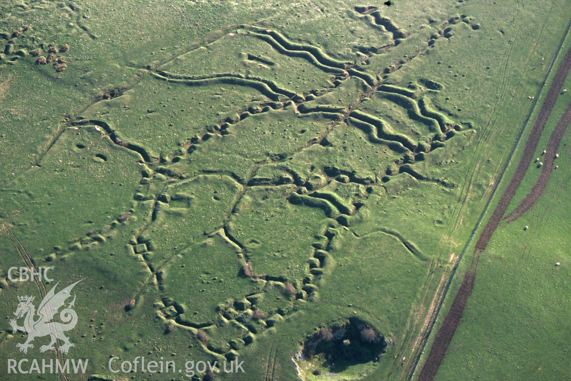 RCAHMW colour oblique aerial photograph of Penally WWI practice trench system. Taken by C R Musson on 13/04/1995