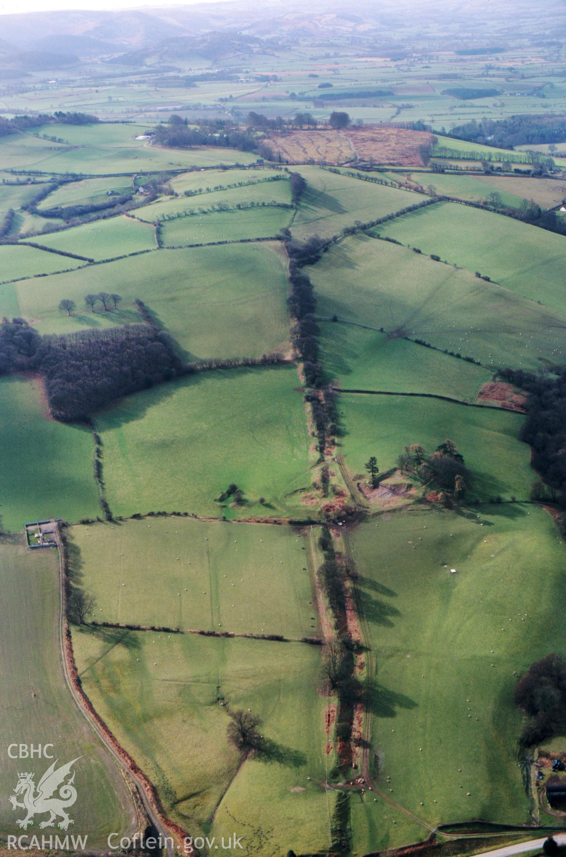 RCAHMW colour slide oblique aerial photograph of a section offa's Dyke from the Whitton to Presteigne Road to the River Lugg, taken on 14/03/1999 by CR Musson