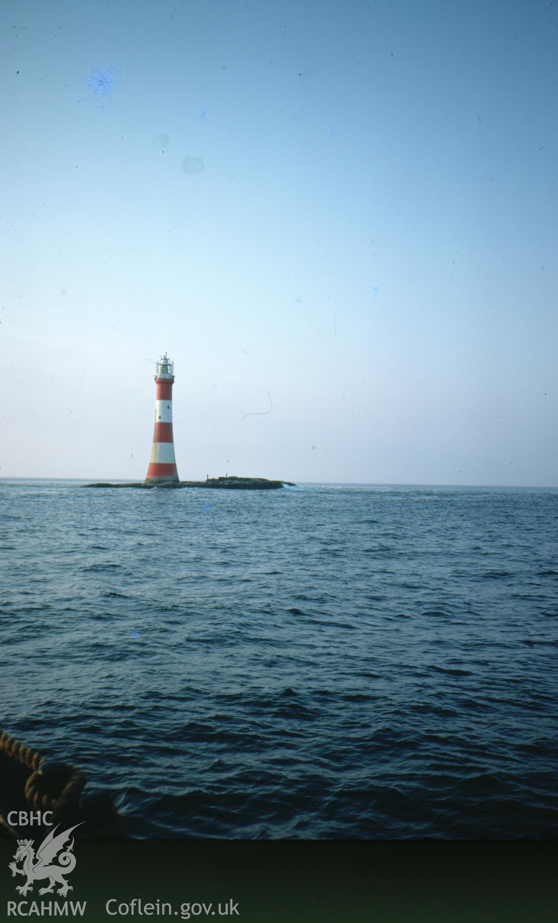 Colour slide showing view of the Smalls Lighthouse at dawn.