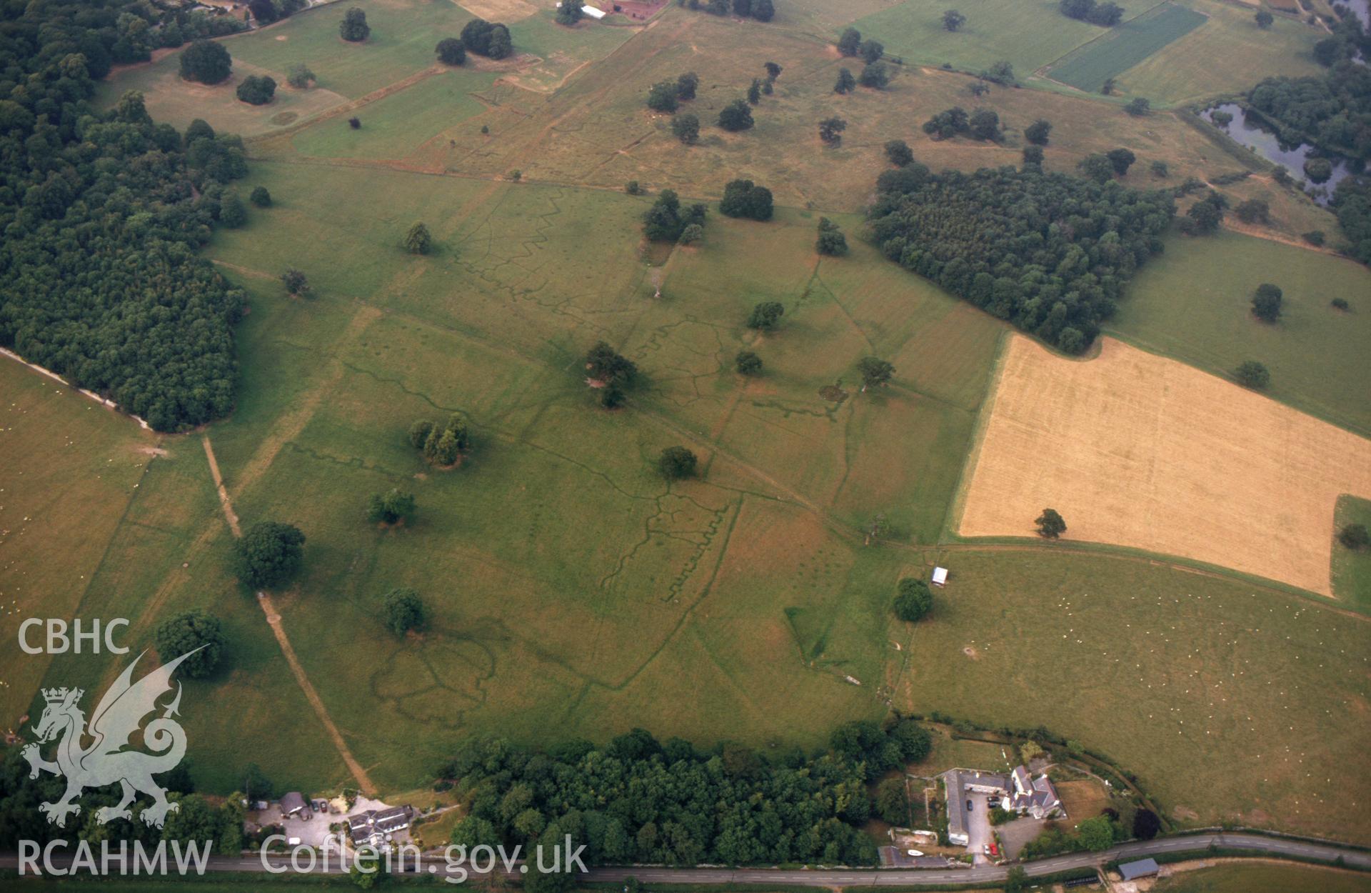 RCAHMW colour slide oblique aerial photograph of army practice trenches at Bodelwyddan Park, Bodelwyddan, taken by C.R.Musson on the 22/07/1996