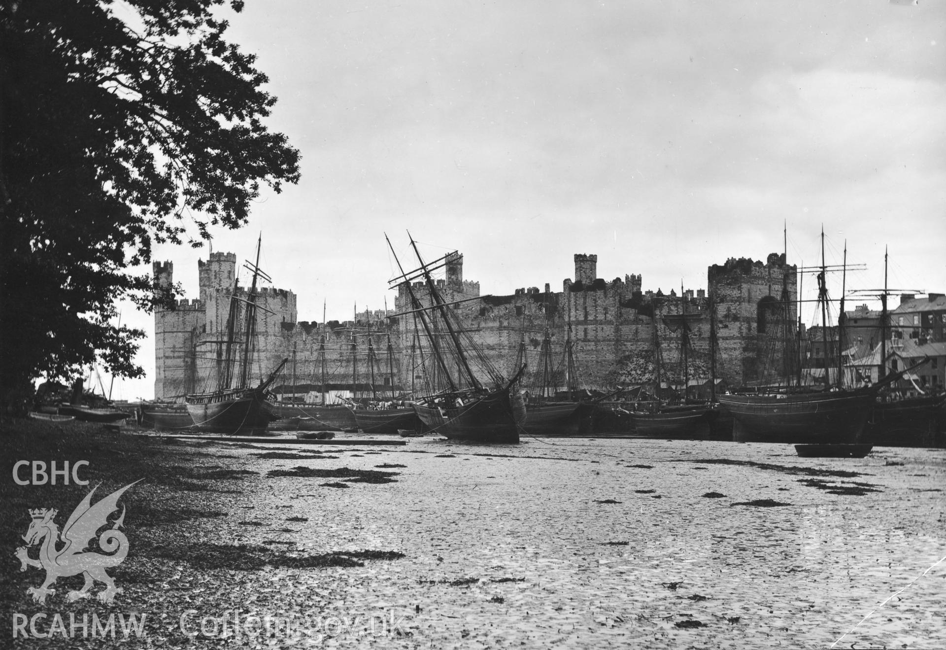 Caernarfon Castle; Slate Quay looking north along the quay with various sailing vessels lying aground.