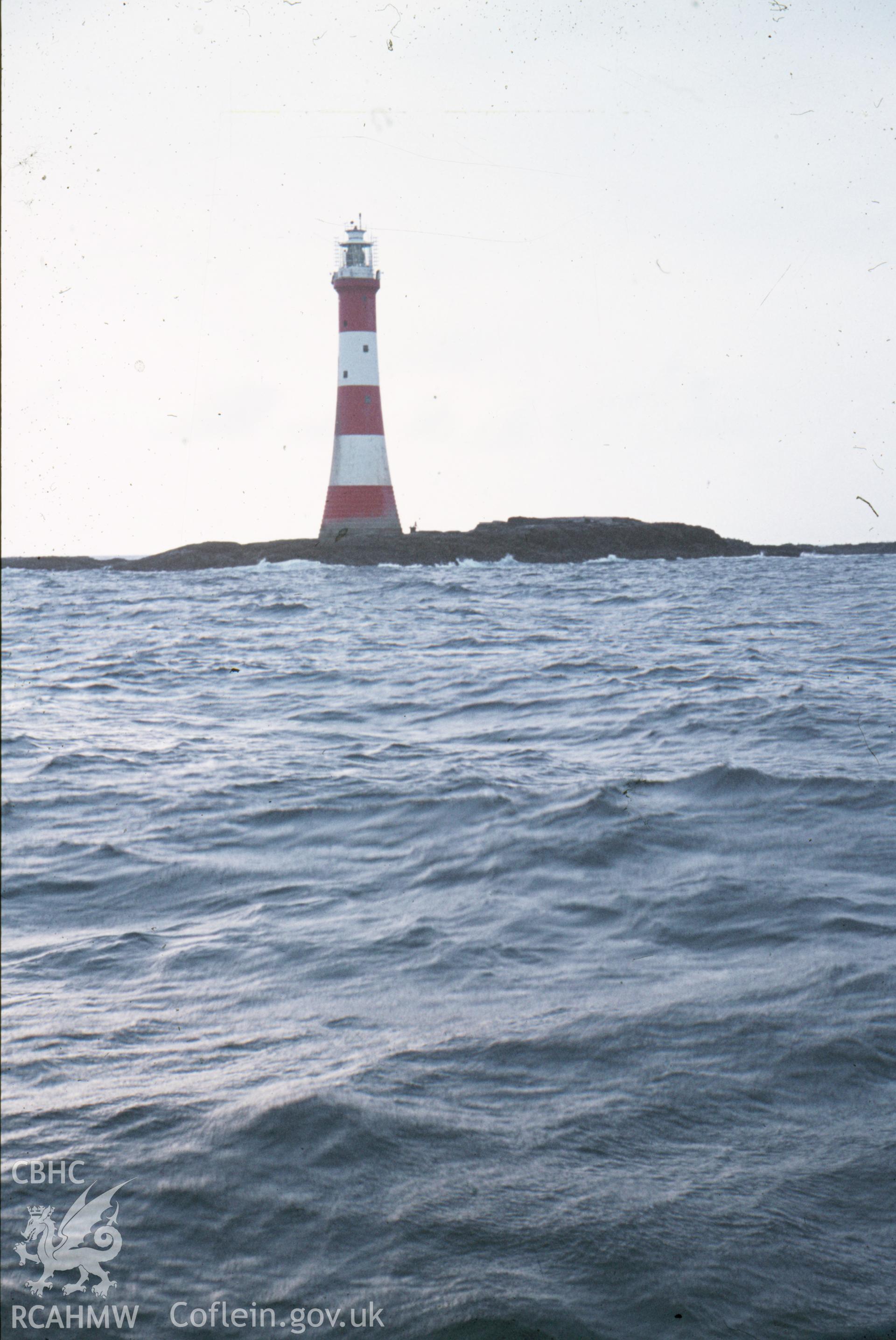 Colour slide showing view of the Smalls Lighthouse from the sea.