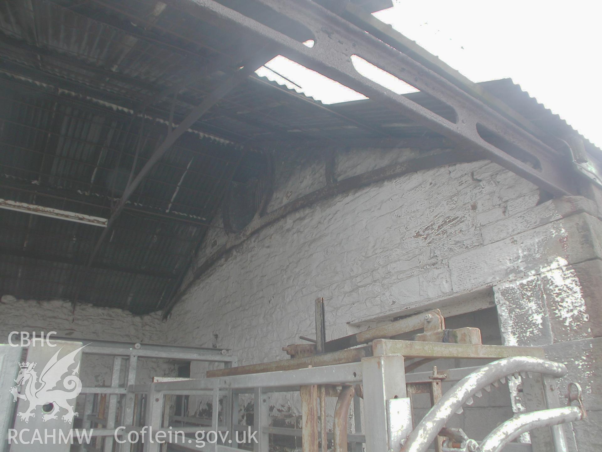 Cast-iron wall-plate and roof trusses near W corner of SE range.